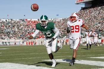 EAST LANSING, MI - NOVEMBER 01:  Chris Rucker #16 of the Michigan State Spartans can't come with with a fourth quarter touchdown pass in front of Niles Brinkley #29 of the Wisconsin Badgers on November 1, 2008 at Spartan Stadium in East Lansing, Michigan.
