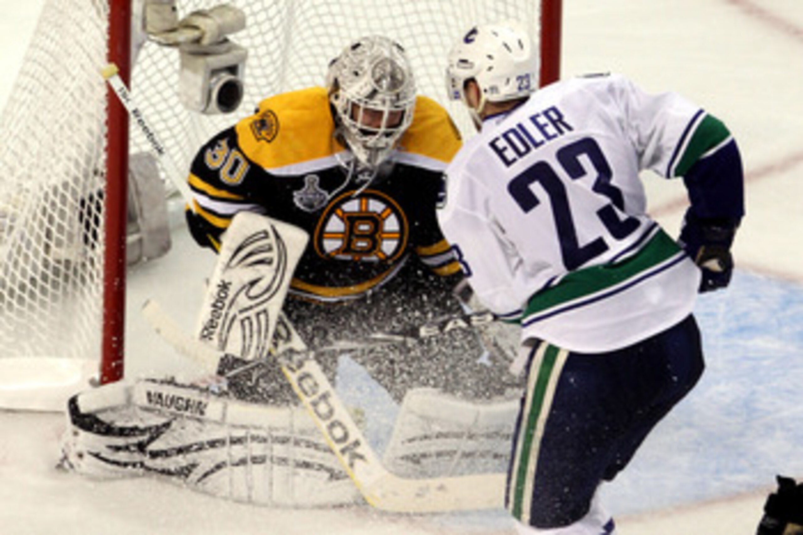 BOSTON, MA - JUNE 06:  Tim Thomas #30 of the Boston Bruins tends goal Alexander Edler #23 of the Vancouver Canucks during Game Three of the 2011 NHL Stanley Cup Final at TD Garden on June 6, 2011 in Boston, Massachusetts.  (Photo by Bruce Bennett/Getty Im