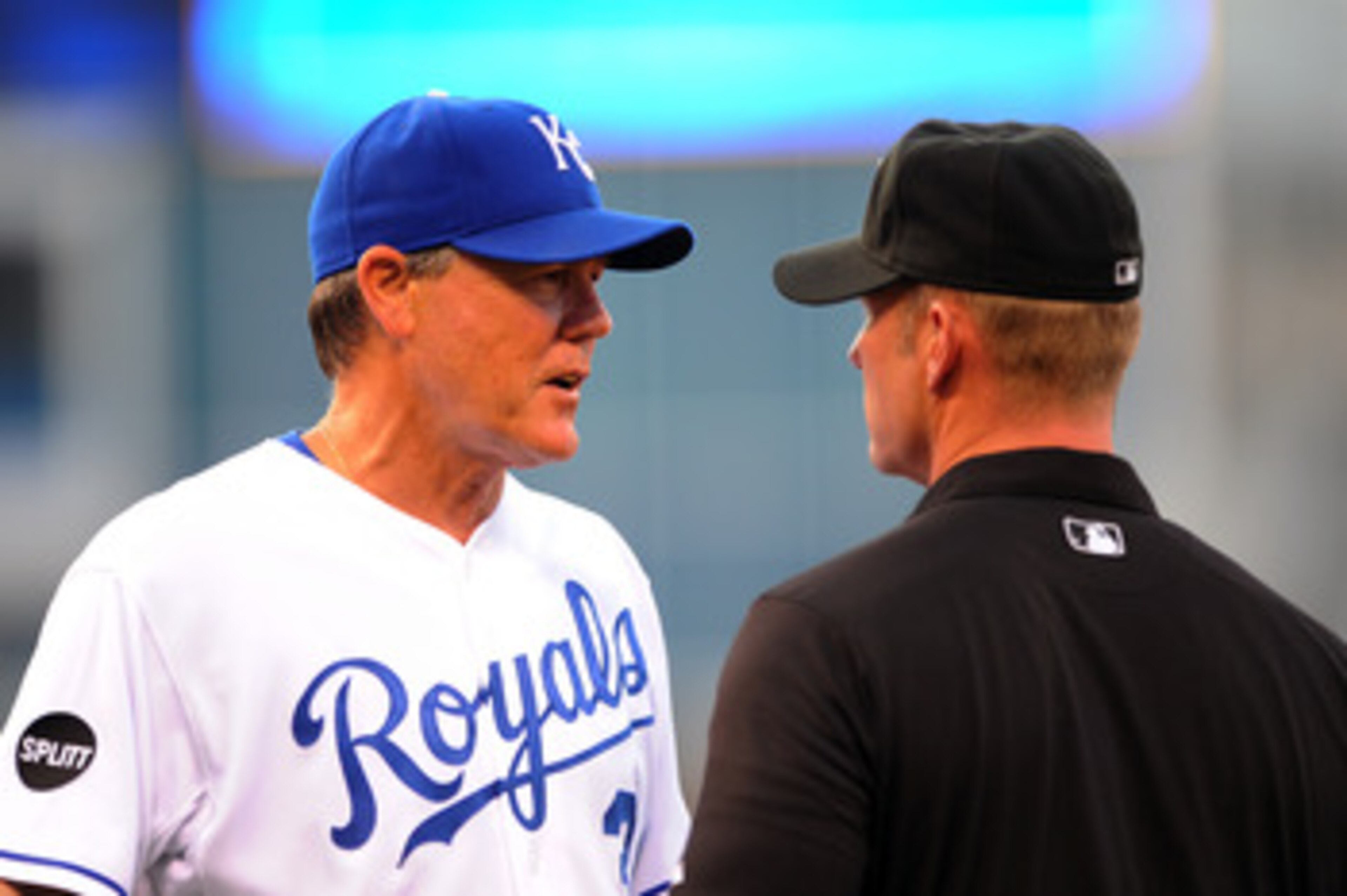 KANSAS CITY, MO - JUNE 6:  Manager Ned Yost #3 of the Kansas City Royals discusses a ruling with first base umpire Jim Wolf #28 after  Yunel Escobar of the Toronto Blue Jays was ruled safe at first base at Kauffman Stadium on June 6, 2011 in Kansas City, 