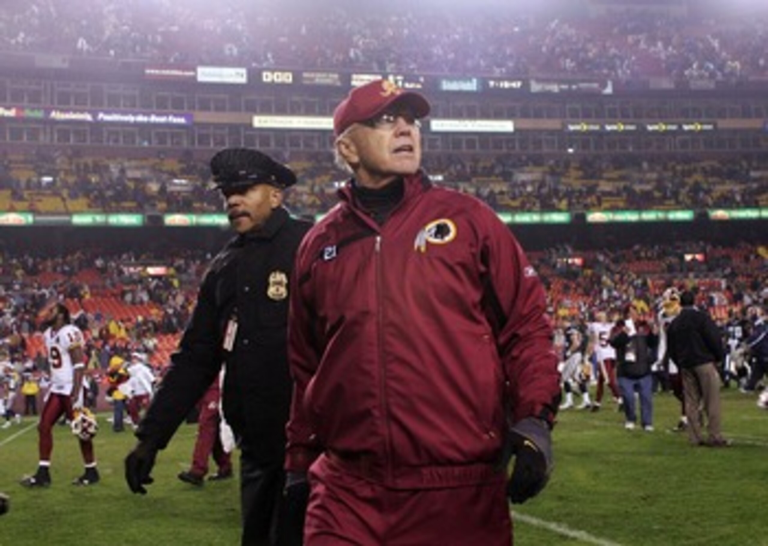 LANDOVER, MD - DECEMBER 30:  Washington Redskins head coach Joe Gibbs walks from the field after defeating the Dallas Cowboys on December 30, 2007 at FedEx Field in Landover, Maryland.  (Photo by Nick Laham/Getty Images)