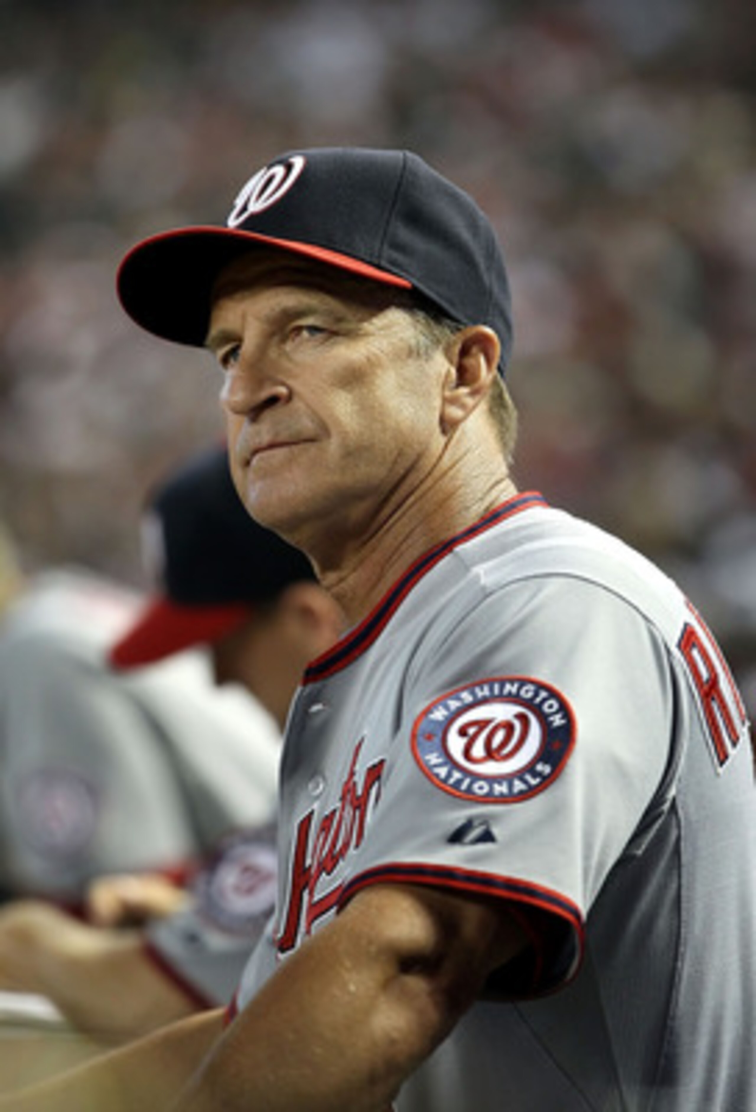 PHOENIX, AZ - JUNE 05:  Manager Jim Riggleman of the Washington Nationals watches from the dugout during the Major League Baseball game against the Arizona Diamondbacks at Chase Field on June 5, 2011 in Phoenix, Arizona. The Nationals defeated the Diamond