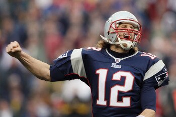 FOXBORO, MA - JANUARY 02:  Tom Brady #12 of the New England Patriots celebrates a touchdown by teammate BenJarvis Green-Ellis in the first quarter against the Miami Dolphins on January 2, 2011 at Gillette Stadium in Foxboro, Massachusetts.  (Photo by Elsa