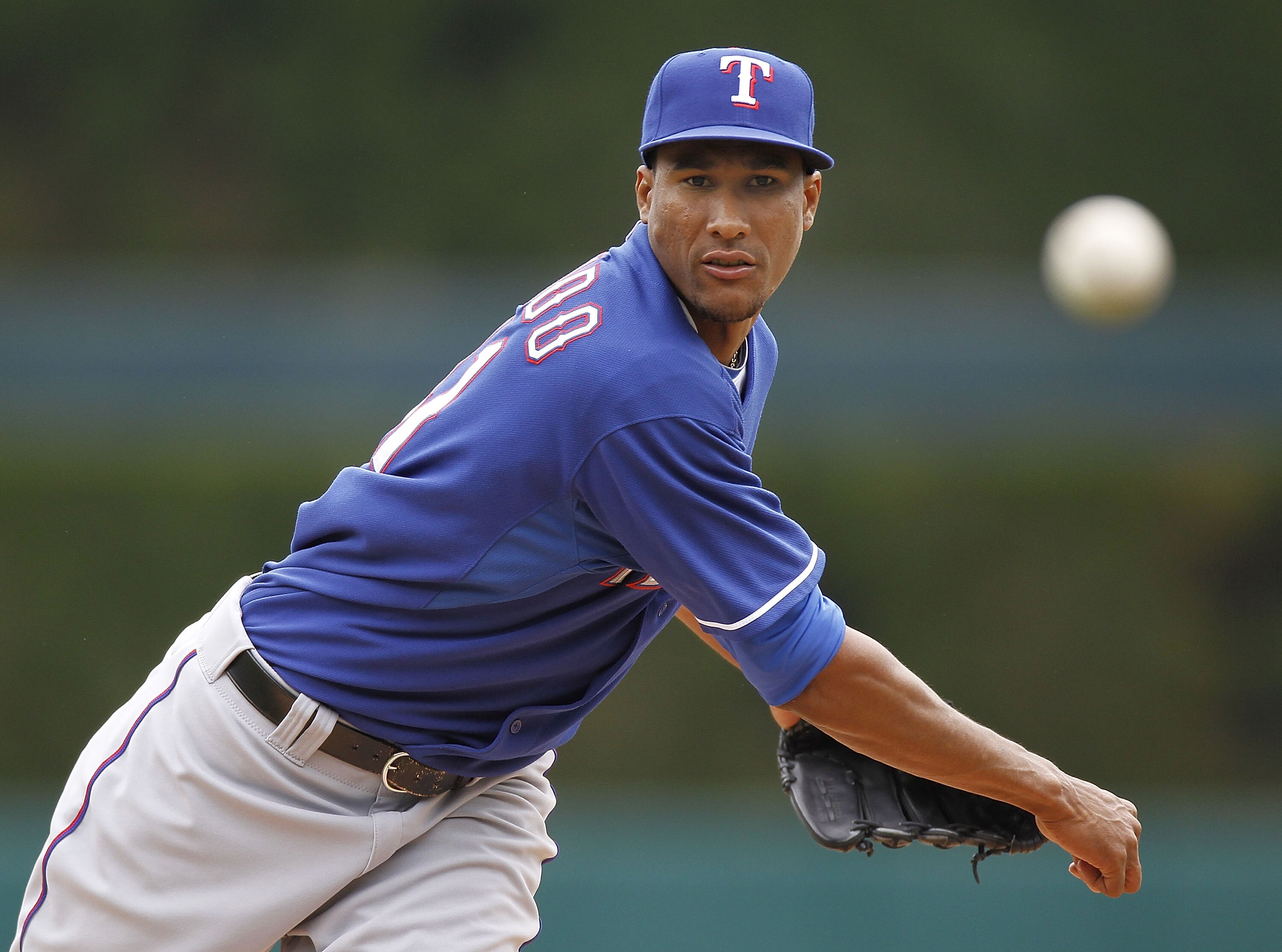 DETROIT, MI - APRIL 11: Alexi Ogando #41 of the Texas Rangers throws a pitch while playing the Detroit Tigers at Comerica Park on April 11, 2011 in Detroit, Michigan. (Photo by Gregory Shamus/Getty Images) DETROIT, MI - APRIL 11: Alexi Ogando #41 of the Texas Rangers throws a pitch while playing the Detroit Tigers at Comerica Park on April 11, 2011 in Detroit, Michigan. (Photo by Gregory Shamus/Getty Images)