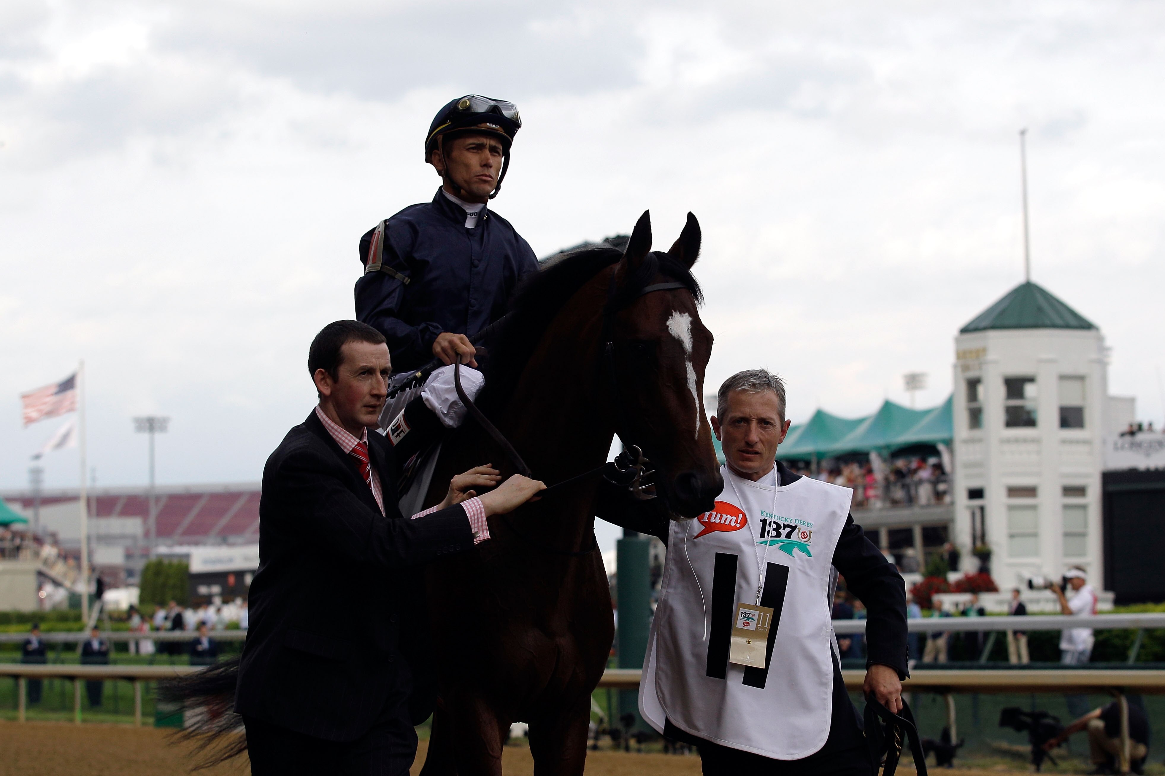 LOUISVILLE, KY - MAY 07:  Jockey Garrett Gomez, riding Master of Hounds #11, is escourted onto the track for the running of the 137th Kentucky Derby at Churchill Downs on May 7, 2011 in Louisville, Kentucky.  (Photo by Rob Carr/Getty Images)