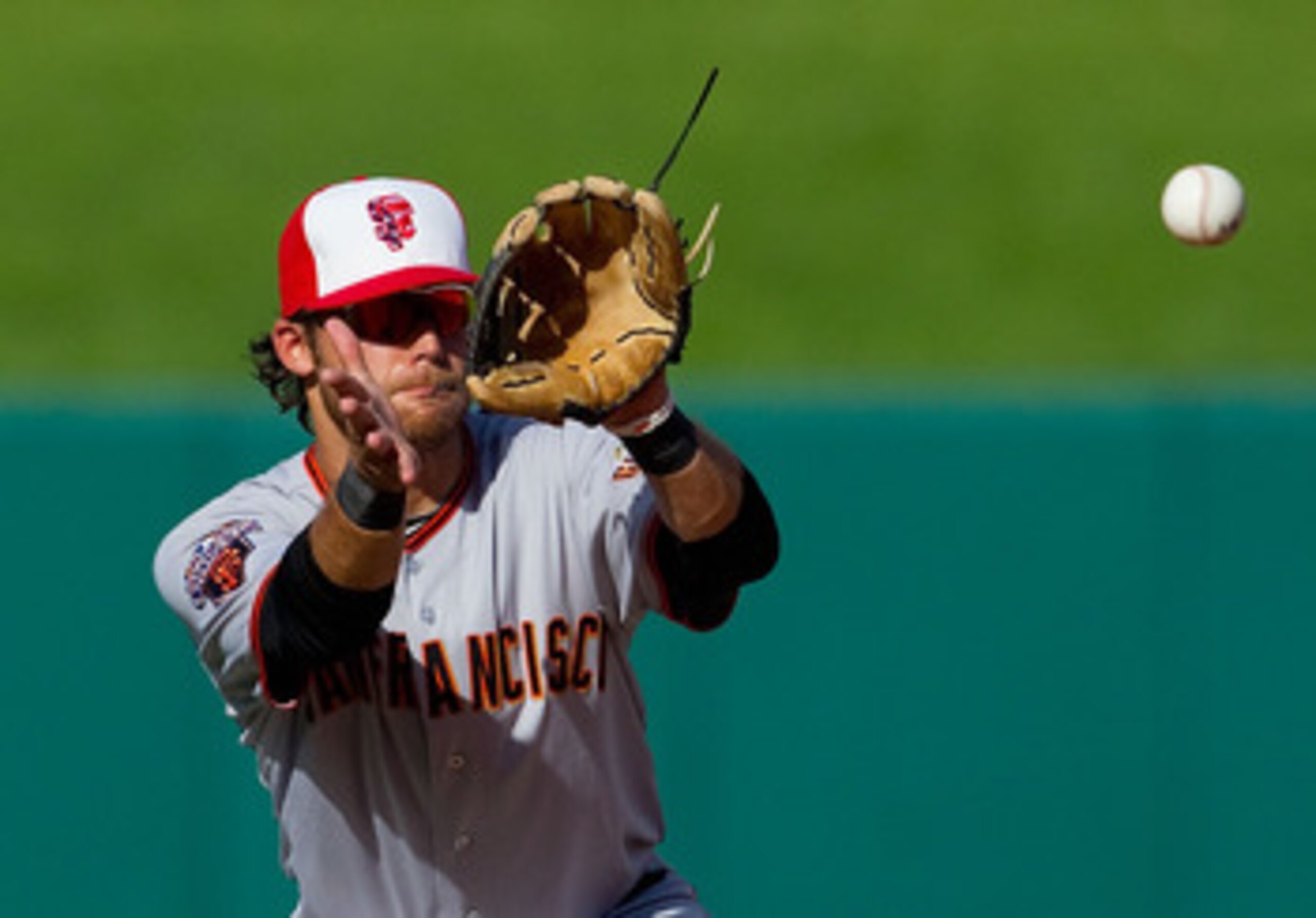 ST. LOUIS, MO - JUNE 1: Brandon Crawford #35 of the San Francisco Giants turns a double play over Pete Kozma #47 of the St. Louis Cardinals at Busch Stadium on June 1, 2011 in St. Louis, Missouri.  (Photo by Dilip Vishwanat/Getty Images)