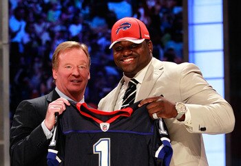 NEW YORK, NY - APRIL 28:  NFL Commissioner Roger Goodell poses for a photo with Marcell Dareus, #3 overall pick by the Buffalo Bills, as Dareus holds up a jersey during the 2011 NFL Draft at Radio City Music Hall on April 28, 2011 in New York City.  (Phot