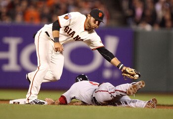 ST. LOUIS, MO - MAY 30:  Brandon Crawford #35 of the San Francisco Giants fields a line drive against the St. Louis Cardinals at Busch Stadium on May 30, 2011 in St. Louis, Missouri.  (Photo by Dilip Vishwanat/Getty Images)