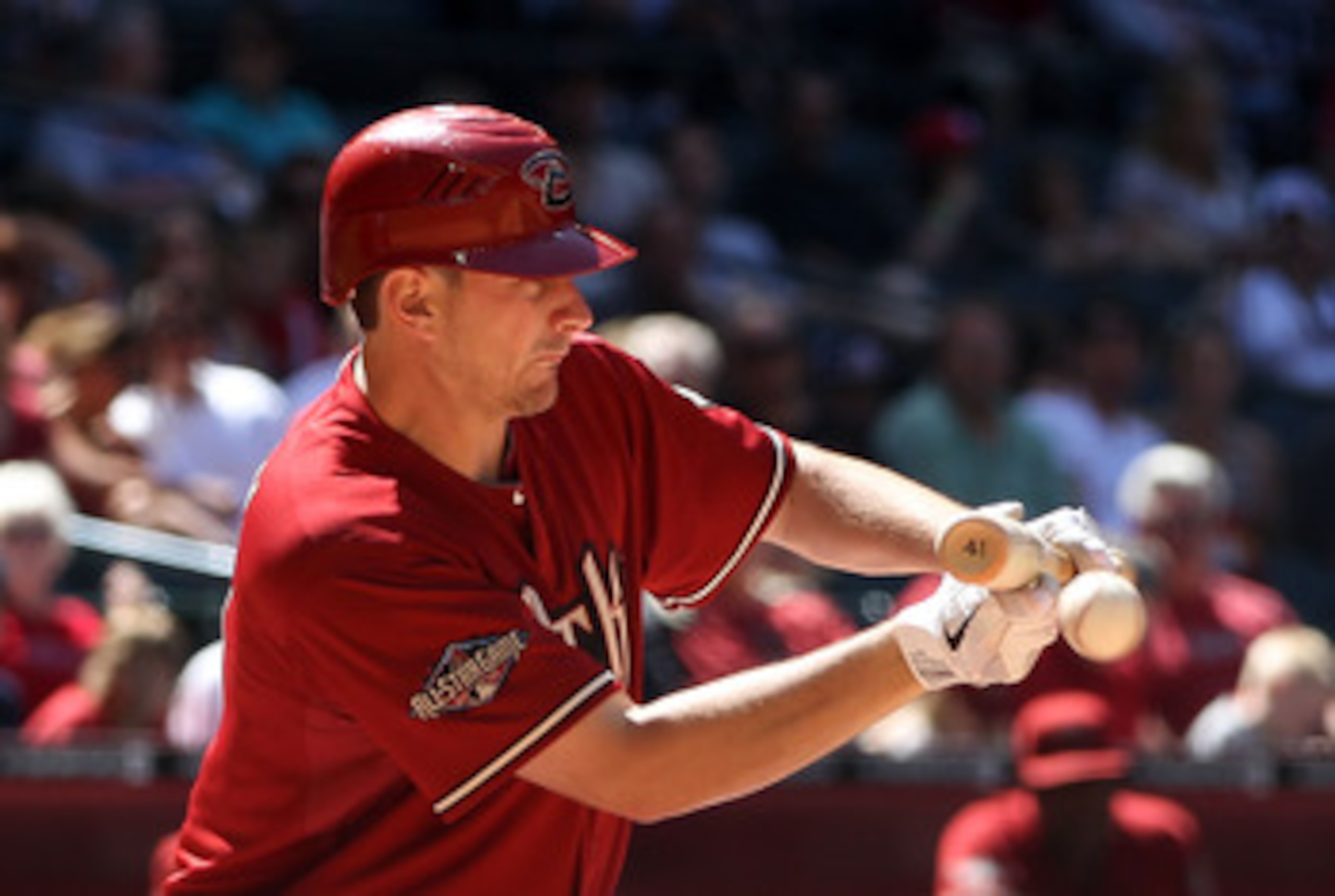 PHOENIX, AZ - MAY 01:  Daniel Hudson #41 of the Arizona Diamondbacks lays down a RBI bunt against the Chicago Cubs during the fourth inning of the Major League Baseball game at Chase Field on May 1, 2011 in Phoenix, Arizona. The Diamondbacks defeated the 