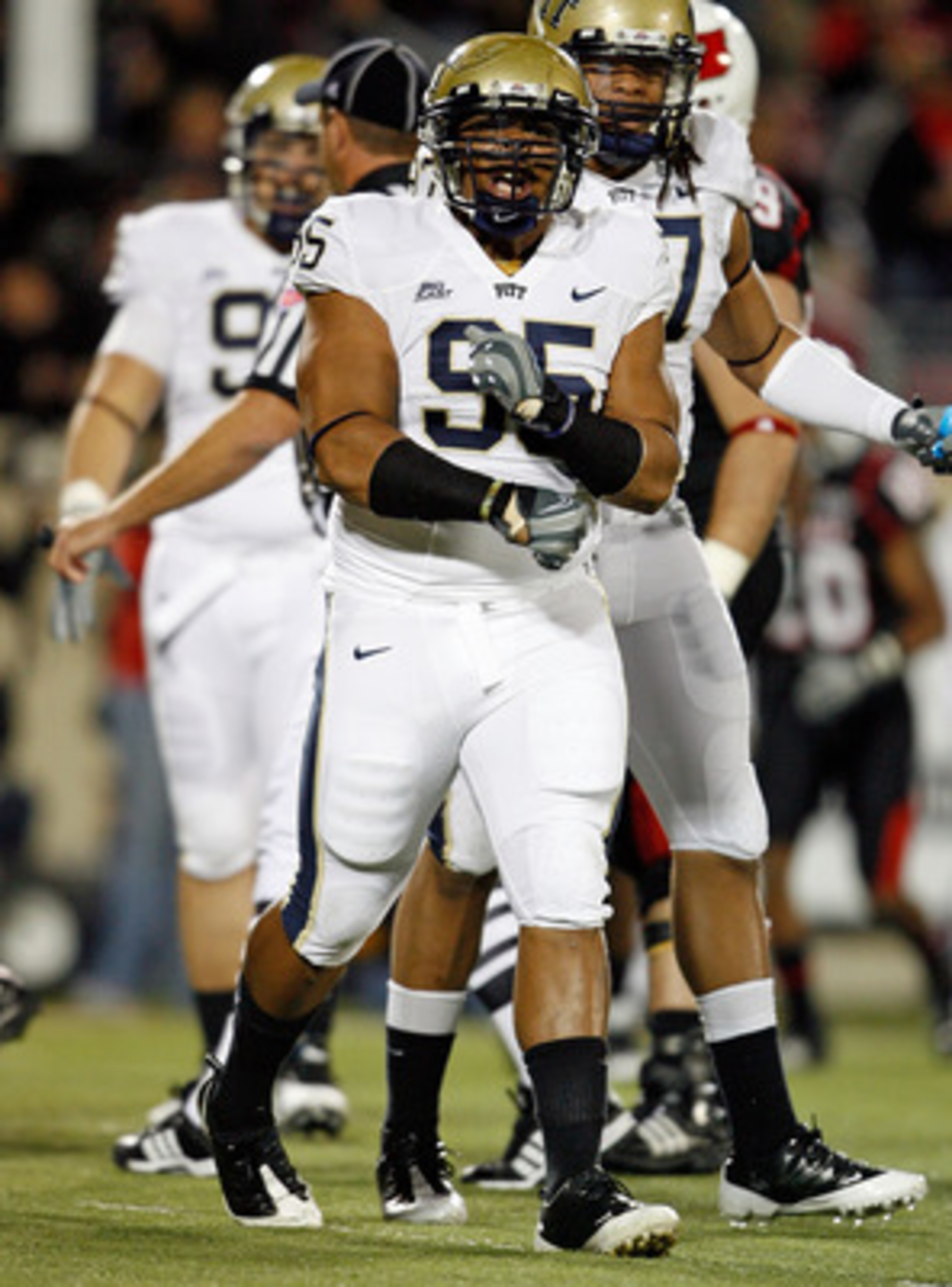 LOUISVILLE, KY - OCTOBER 02:  Mick Williams #95 of the Pittsburgh Panthers celebrates a defensive stop during the Big East Conference game against the Louisville Cardinals at Papa John's Cardinal Stadium on October 2, 2009 in Louisville, Kentucky.  (Photo