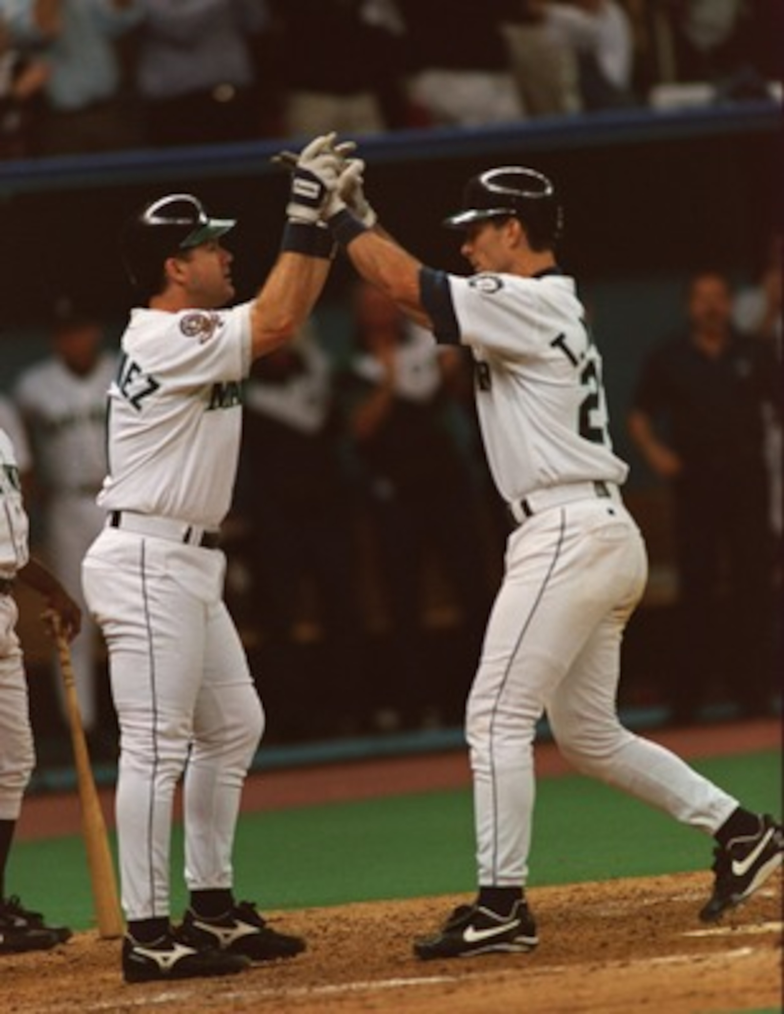 6 OCT 1995:  SEATTLE MARINERS BATTERS EDGAR MARTINEZ (LEFT) CELEBRATES WITH TINO MARTINEZ AFTER A TWO RUN HOMERUN DURING THE MARINERS VERSUS NEW YORK YANKEES AMERICAN LEAGUE PLAYOFF GAME AT THE KINGDOME IN SEATTLE, WASHINGTON. Mandatory Credit: Stephen Du