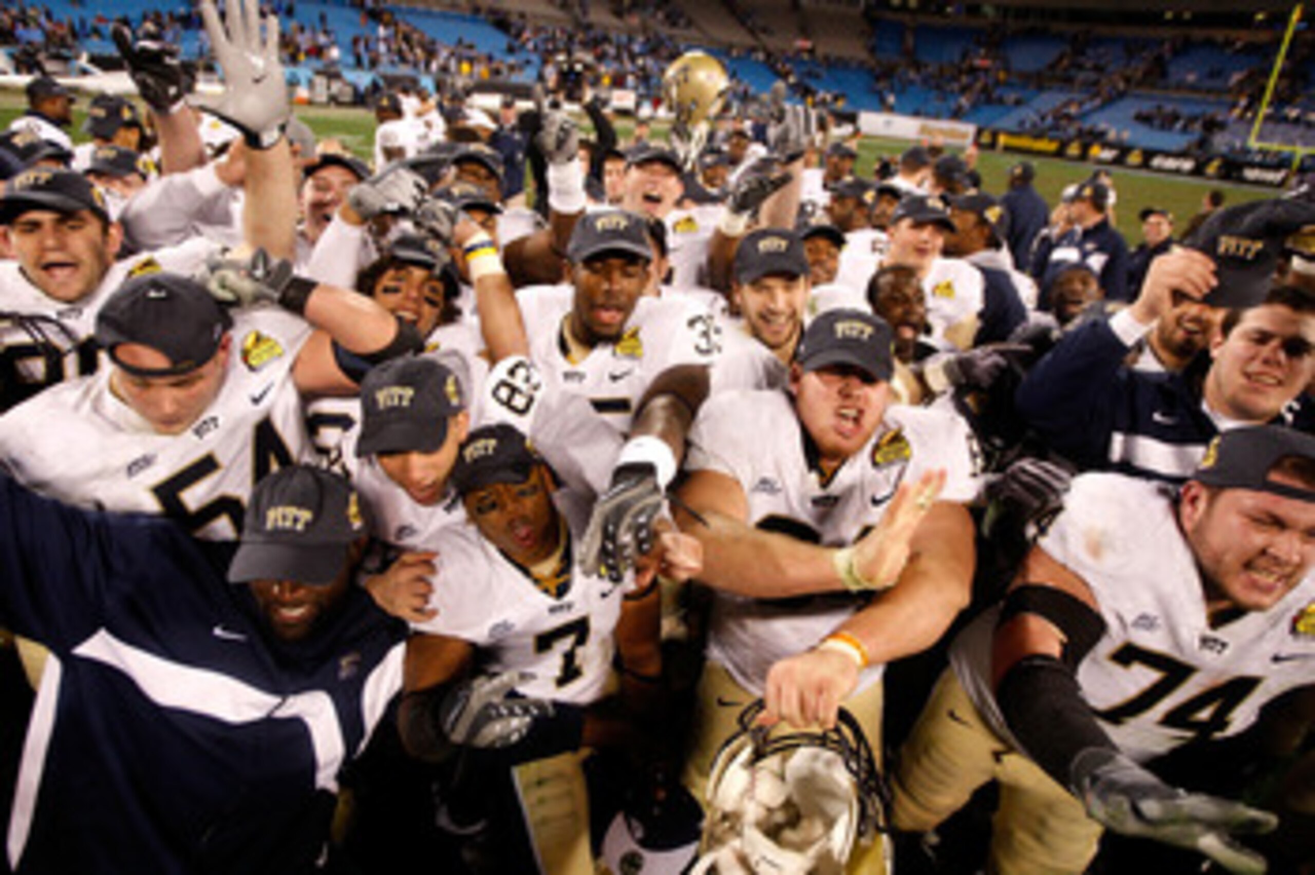 CHARLOTTE, NC - DECEMBER 26: The Pittsburgh Panthers celebrate a 19-17 victory over the North Carolina Tar Heels after their game on December 26, 2009 in Charlotte, North Carolina. (Photo by Streeter Lecka/Getty Images) CHARLOTTE, NC - DECEMBER 26: The Pittsburgh Panthers celebrate a 19-17 victory over the North Carolina Tar Heels after their game on December 26, 2009 in Charlotte, North Carolina. (Photo by Streeter Lecka/Getty Images)