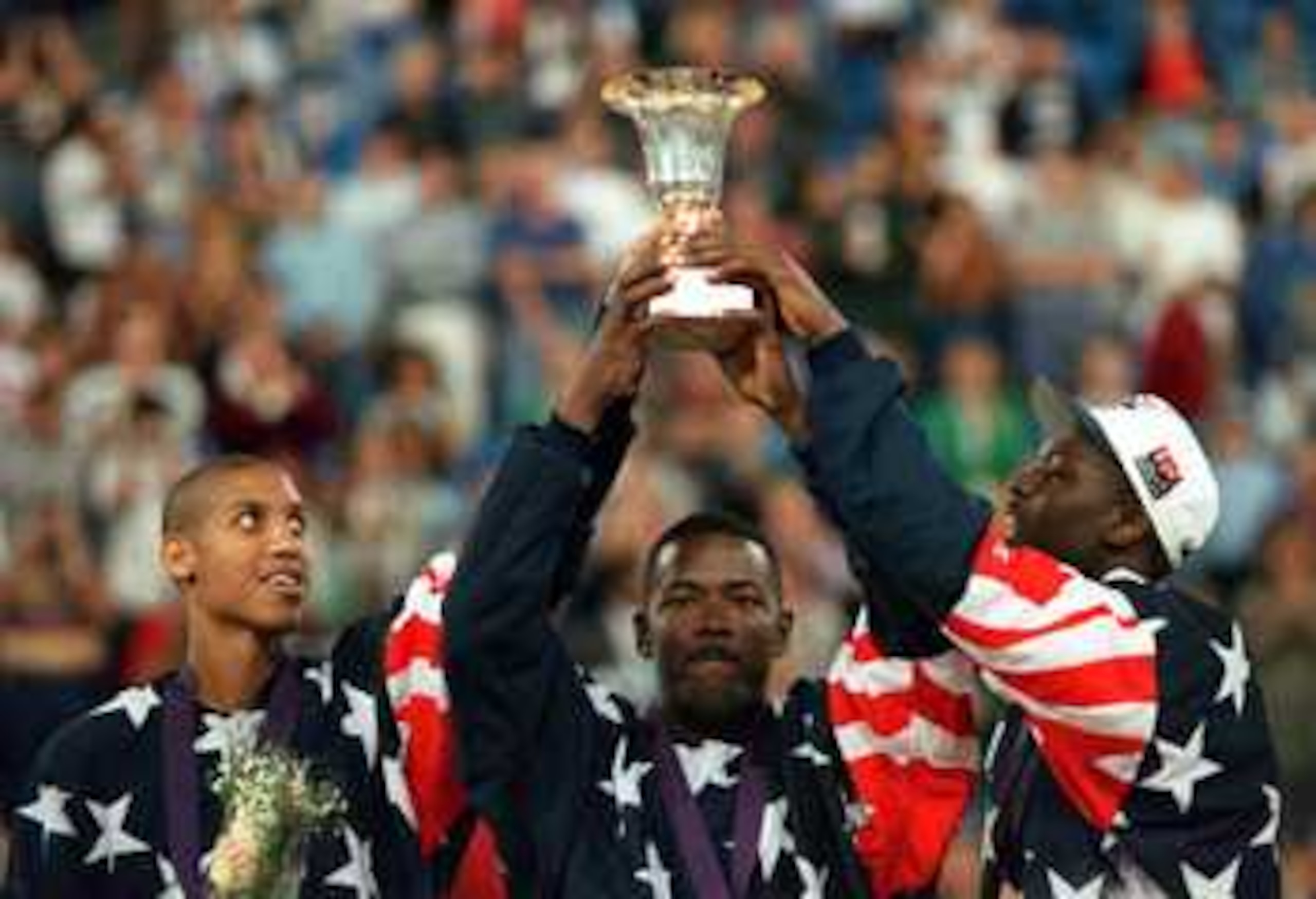 14 AUG 1994: REGGIE MILLER, JOE DUMARS AND LARRY JOHNSON CELEBRATE WITH THE TROPHY AS THE USA  DREAM TEAM II DEFEATS RUSSIA 137-91 IN THE WORLD CHAMPIONSHIP FINAL AT THE SKYDOME STADIUM IN TORONTO, ONTARIO, CANADA. Mandatory Credit: Doug Pensinger/ALLSPO