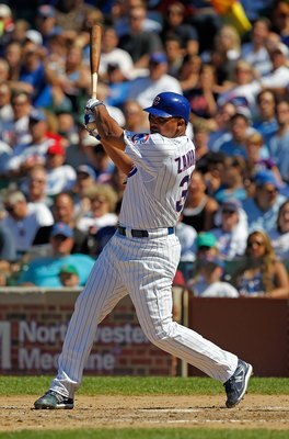 CHICAGO - JUNE 20: Carlos Zambrano #38 of the Chicago Cubs hits a single in the 7th inning against the Los Angeles Angels of Anaheim at Wrigley Field on June 20, 2010 in Chicago, Illinois. The Cubs defeated the Angels 12-1. (Photo by Jonathan Daniel/Getty