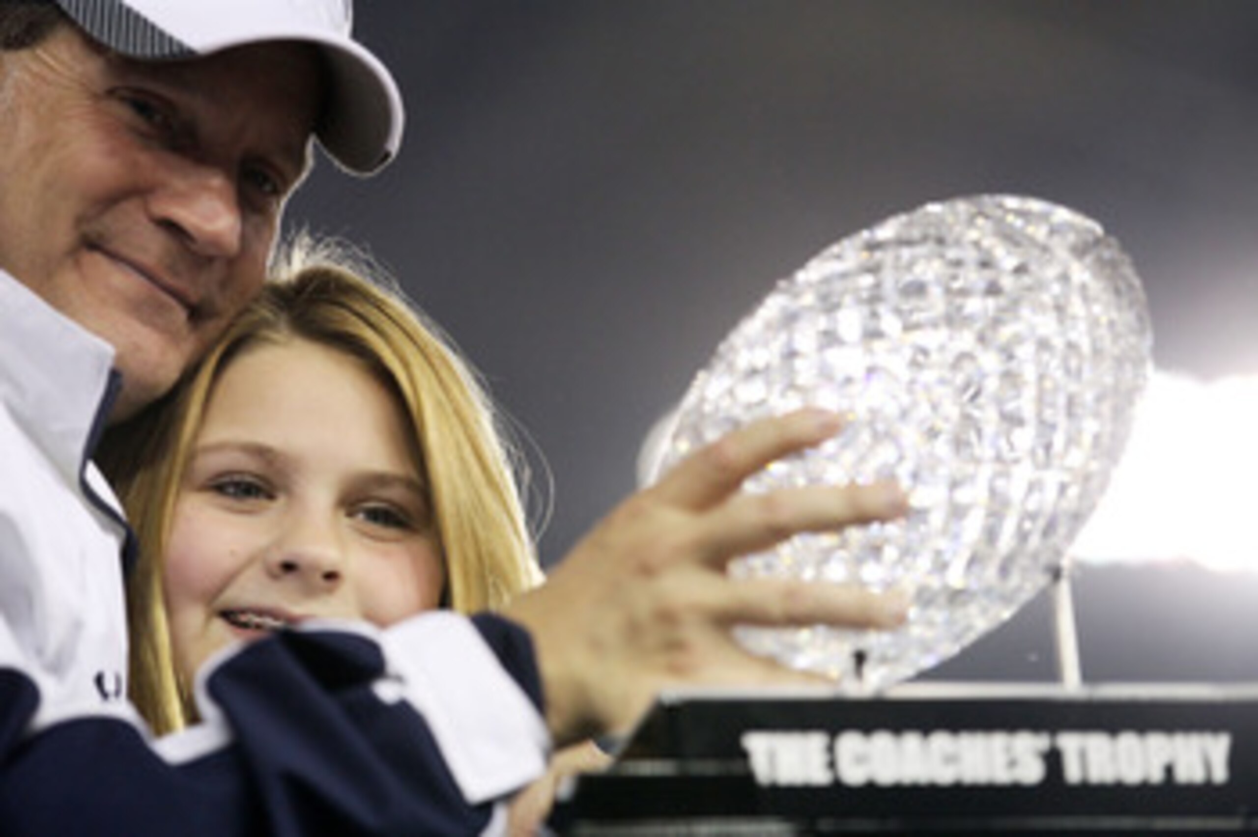 GLENDALE, AZ - JANUARY 10:  Head coach Gene Chizik of the Auburn Tigers celebrates the Tigers 22-19 victory against the Oregon Ducks during the Tostitos BCS National Championship Game at University of Phoenix Stadium on January 10, 2011 in Glendale, Arizo