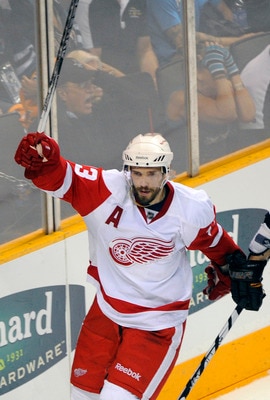 SAN JOSE, CA - MAY 12:  Pavel Datsyuk #13 of the Detroit Red Wings celebrates after scoring a goal in the third period against the San Jose Sharks in Game Seven of the Western Conference Semifinals  during the 2011 NHL Stanley Cup Playoffs at the HP Pavil