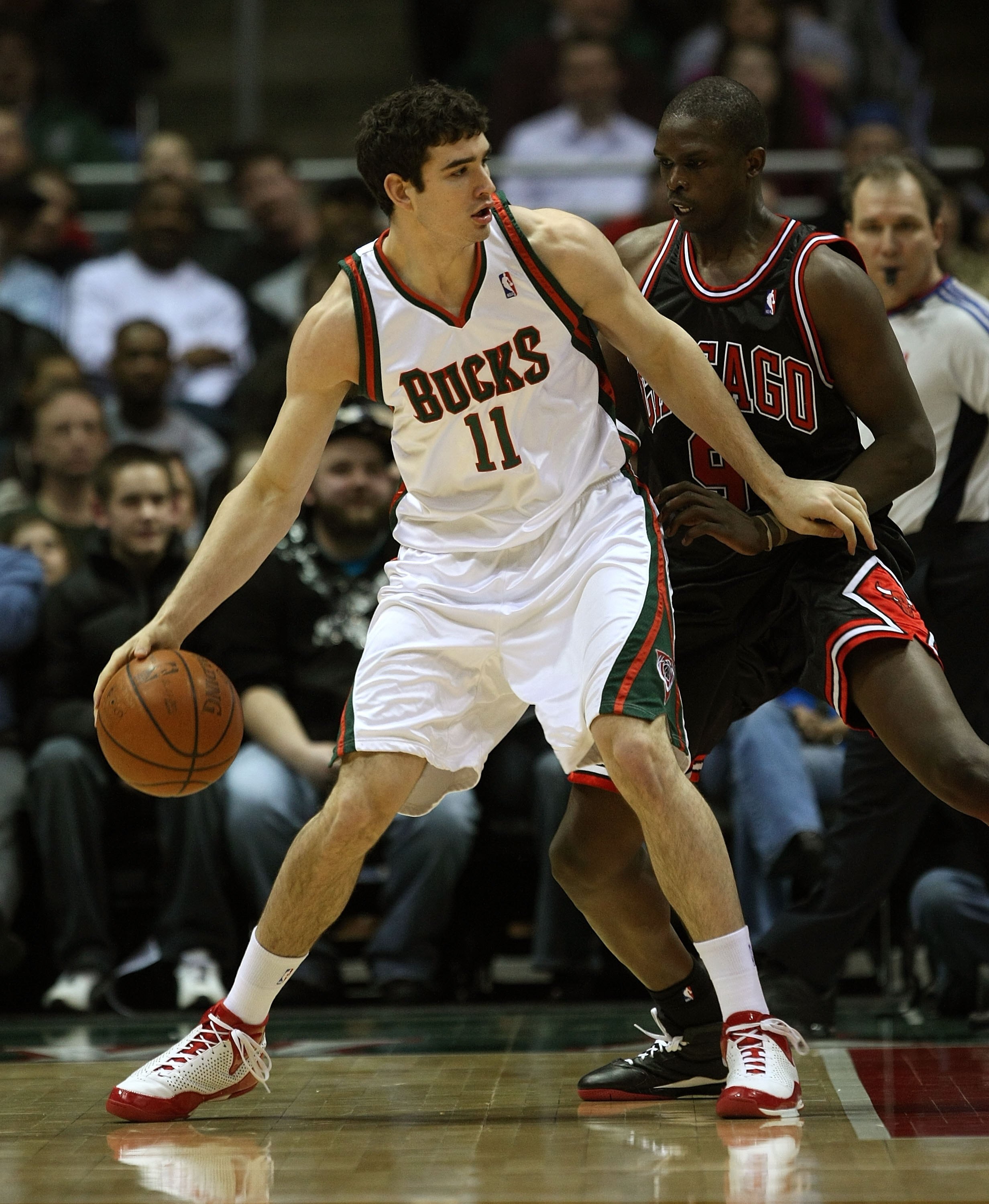 MILWAUKEE - FEBRUARY 18: Joe Alexander #11 of the Milwaukee Bucks moves against Loul Deng #9 of the Chicago Bulls on February 18, 2009 at the Bradley Center in Milwaukee, Wisconsin. The Bulls defeated the Bucks 133-104. NOTE TO USER: User expressly acknow