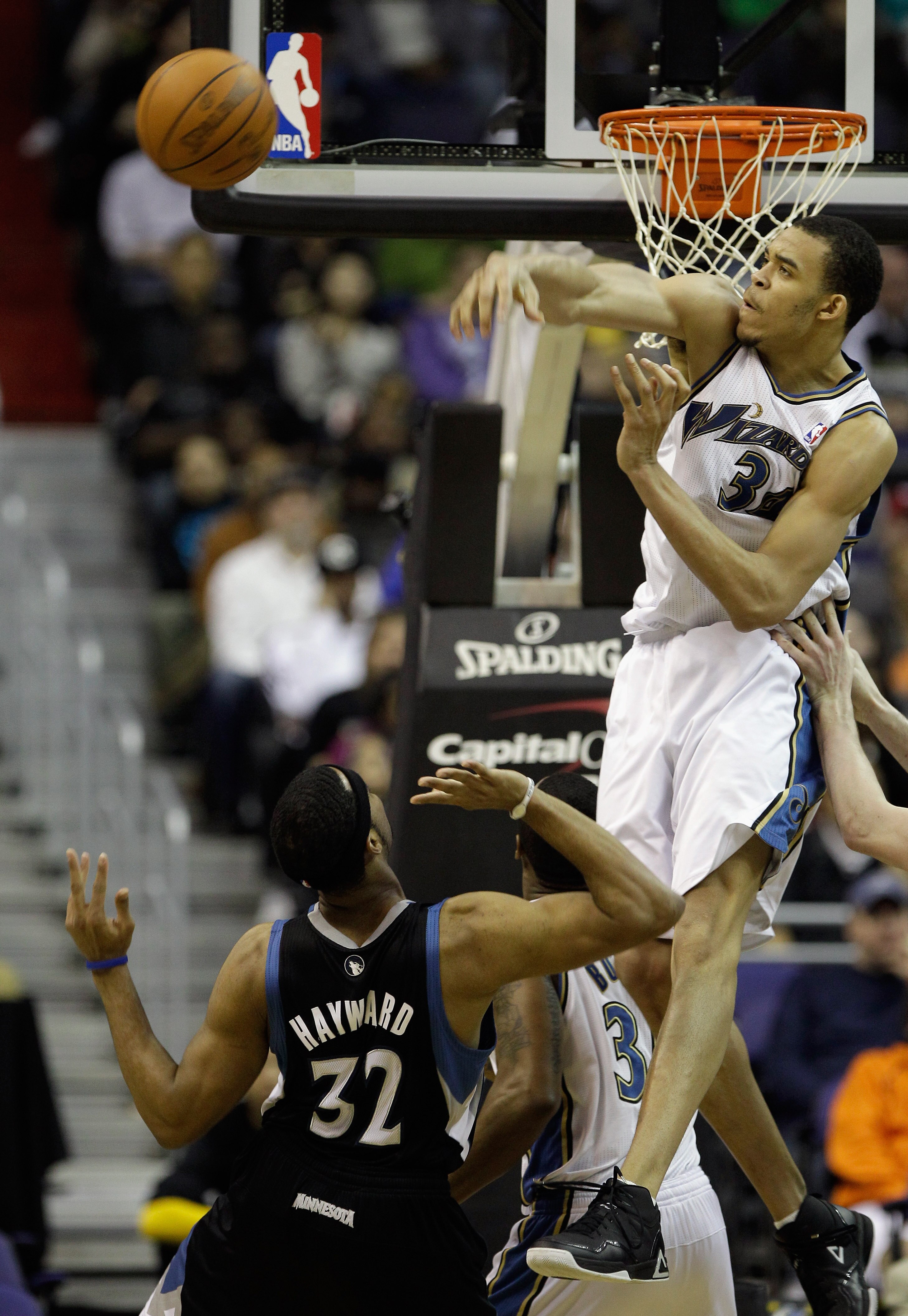 WASHINGTON, DC - MARCH 05:  JaVale McGee #34 of the Washington Wizards blocks a shot by Lazar Hayward #32 of the Minnesota Timberwolves at the Verizon Center on March 5, 2011 in Washington, DC. NOTE TO USER: User expressly acknowledges and agrees that, by