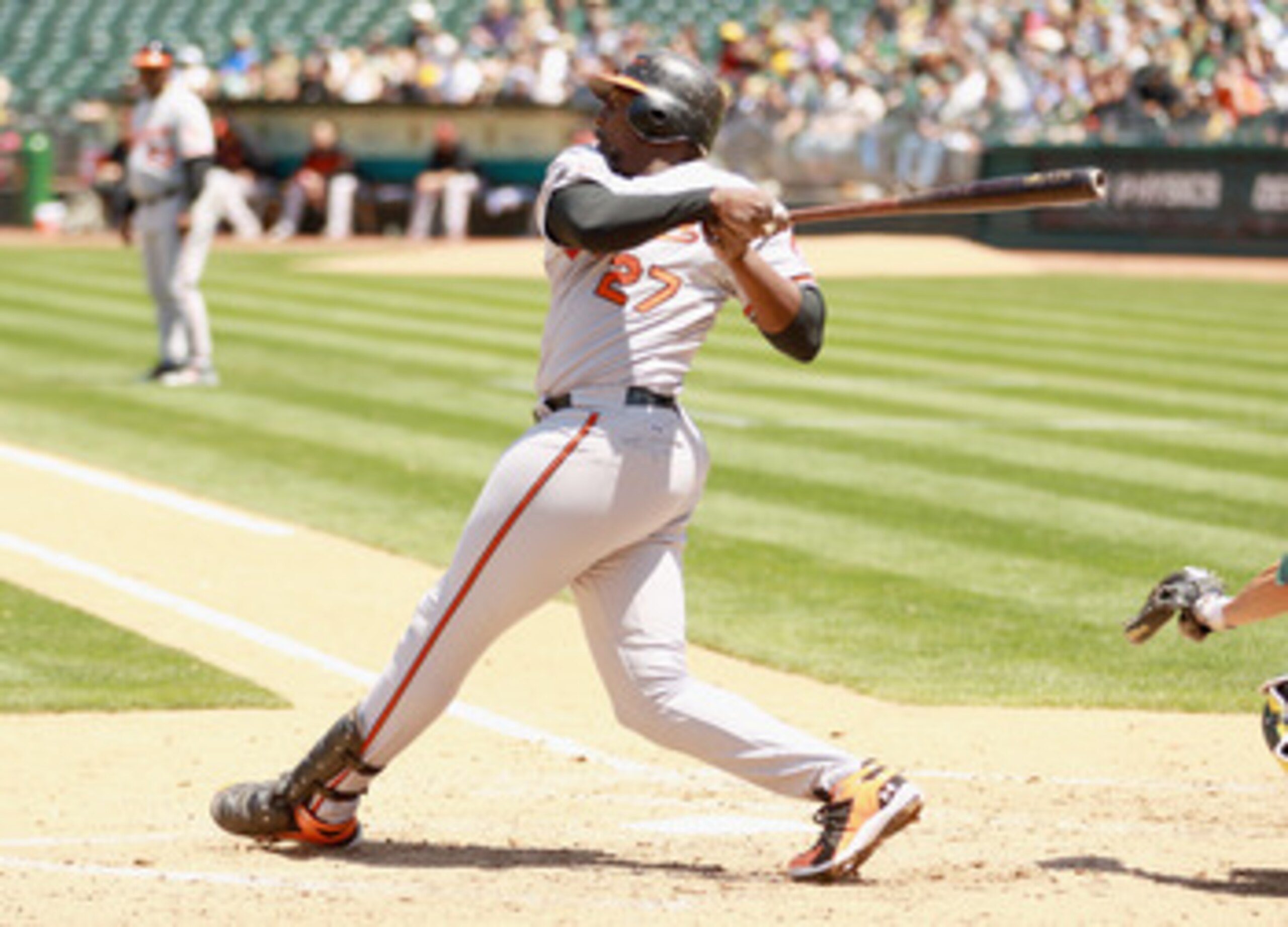 OAKLAND, CA - MAY 29:  Vladimir Guerrero #27 of the Baltimore Orioles hits a ground out RBI that scored Felix Pie #18 of the Baltimore Orioles in the fifth inning against the Oakland Athletics at Oakland-Alameda County Coliseum on May 29, 2011 in Oakland,