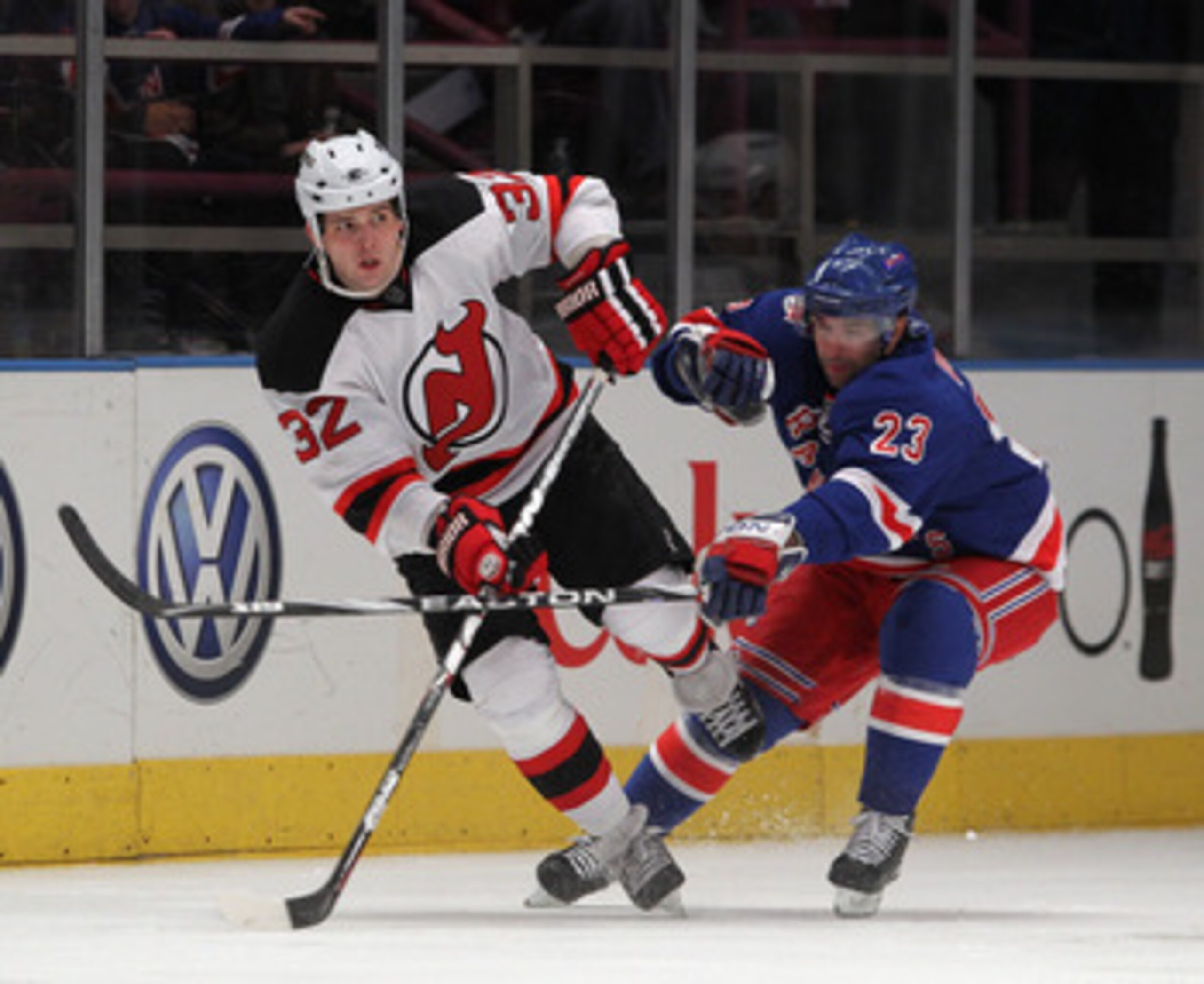 NEW YORK, NY - APRIL 09: Chris Drury #23 of the New York Rangers checks Nick Palmieri #32 of the New Jersey Devils skates against the New Jersey Devils at Madison Square Garden on April 9, 2011 in New York City.  (Photo by Bruce Bennett/Getty Images)
