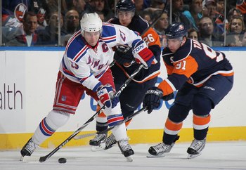 UNIONDALE, NY - MARCH 30:  Chris Drury #23 of the New York Rangers skates against John Tavares #91 of the New York Islanders at the Nassau Coliseum on March 30, 2010 in Uniondale, New York.  (Photo by Bruce Bennett/Getty Images)