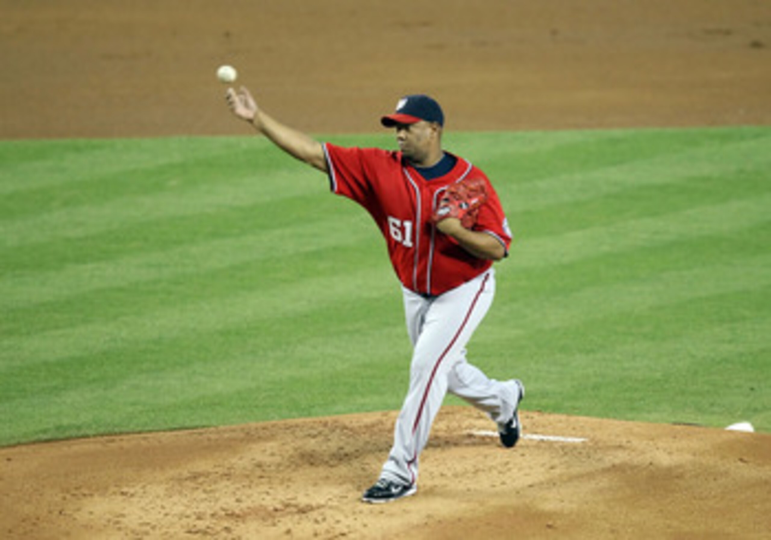 PHOENIX, AZ - JUNE 04:  Starting pitcher Livan Hernandez #61 of the Washington Nationals pitches against the Arizona Diamondbacks during the Major League Baseball game at Chase Field on June 4, 2011 in Phoenix, Arizona.  The Diamondbacks defeated the Nati