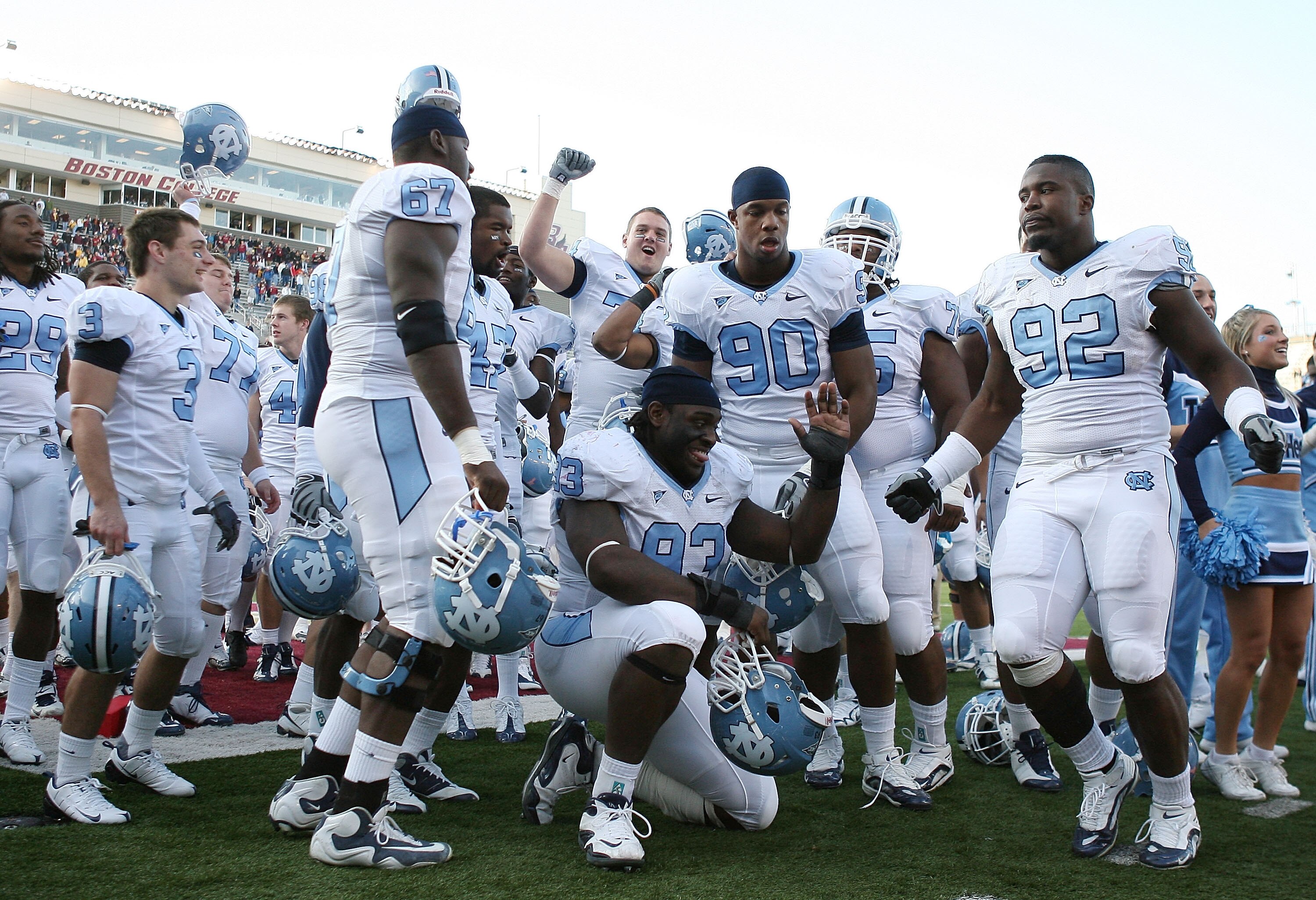 CHESTNUT HILL, MA - NOVEMBER 21:  E.J. Wilson #92 ,Greg Elleby #67, Cam Thomas #93 and Quinton Coples #90 of the North Carolina Tar Heels celebrate after the game against the Boston College Eagles on November 21, 2009 at Alumni Stadium in Chestnut Hill, M