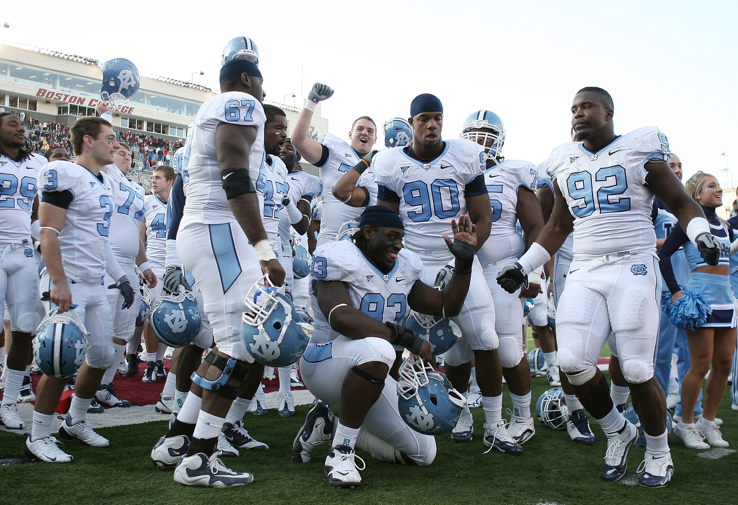 CHESTNUT HILL, MA - NOVEMBER 21:  E.J. Wilson #92 ,Greg Elleby #67, Cam Thomas #93 and Quinton Coples #90 of the North Carolina Tar Heels celebrate after the game against the Boston College Eagles on November 21, 2009 at Alumni Stadium in Chestnut Hill, M
