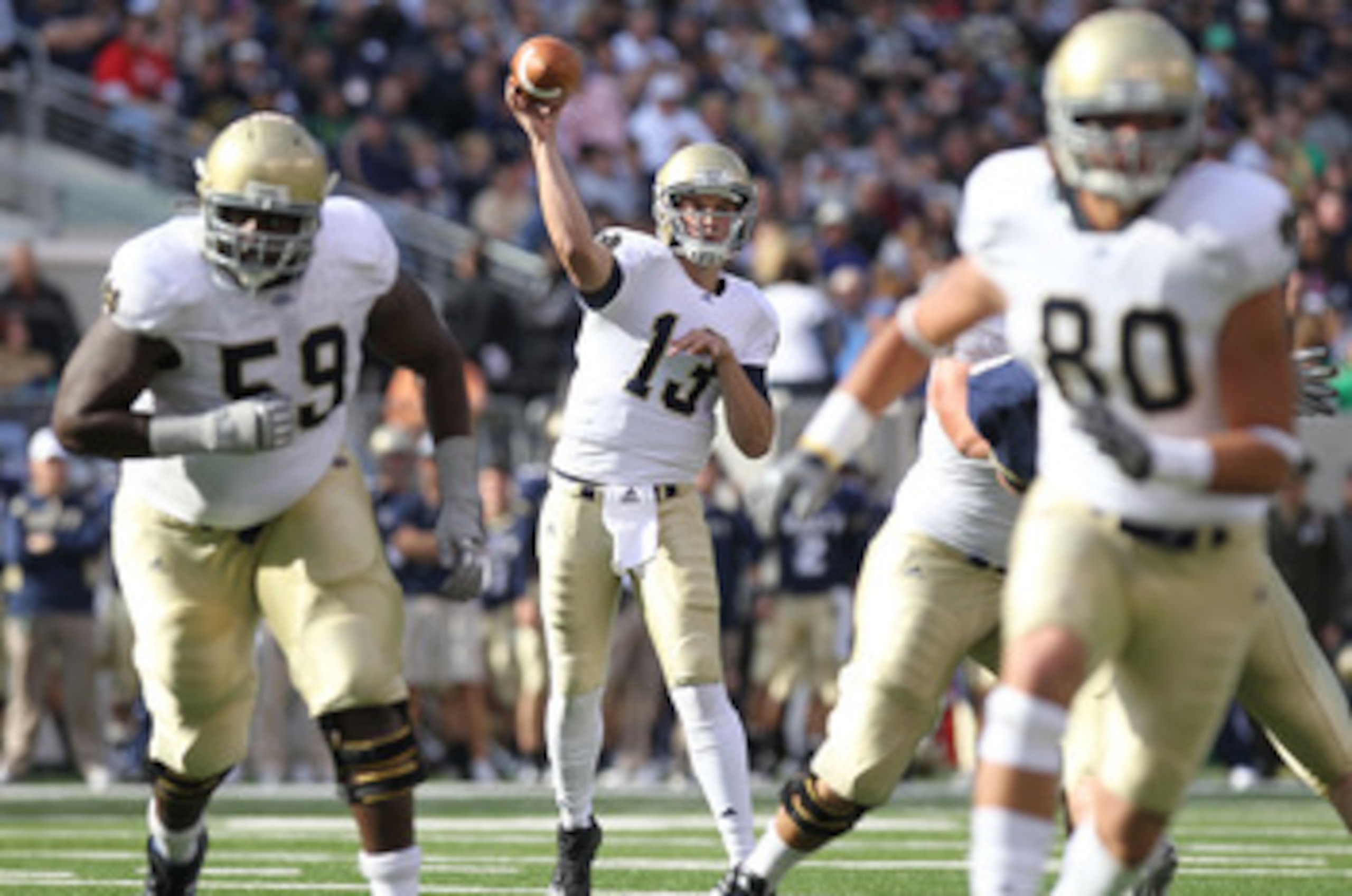 EAST RUTHERFORD, NJ - OCTOBER 23: Tommy Rees #13 of the Notre Dame Fighting Irish passes the ball against the Navy Midshipmen at New Meadowlands Stadium on October 23, 2010 in East Rutherford, New Jersey.  (Photo by Nick Laham/Getty Images)