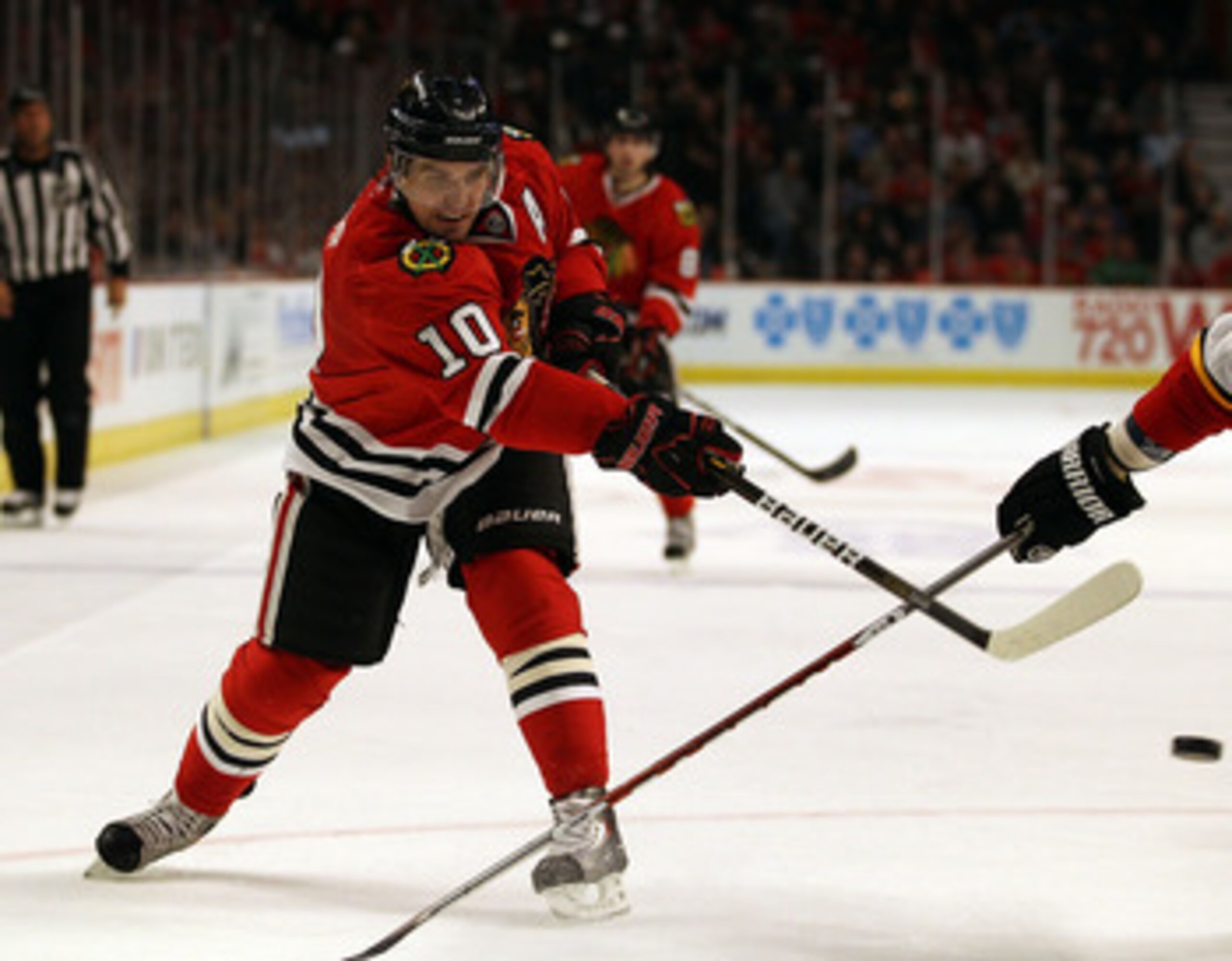 CHICAGO, IL - MARCH 02: Patrick Sharp of the Chicago Blackhawks shoots the puck against the Calgary Flames at the United Center on March 2, 2011 in Chicago, Illinois. The Blackhawks defeated the Flames 5-2. (Photo by Jonathan Daniel/Getty Images)