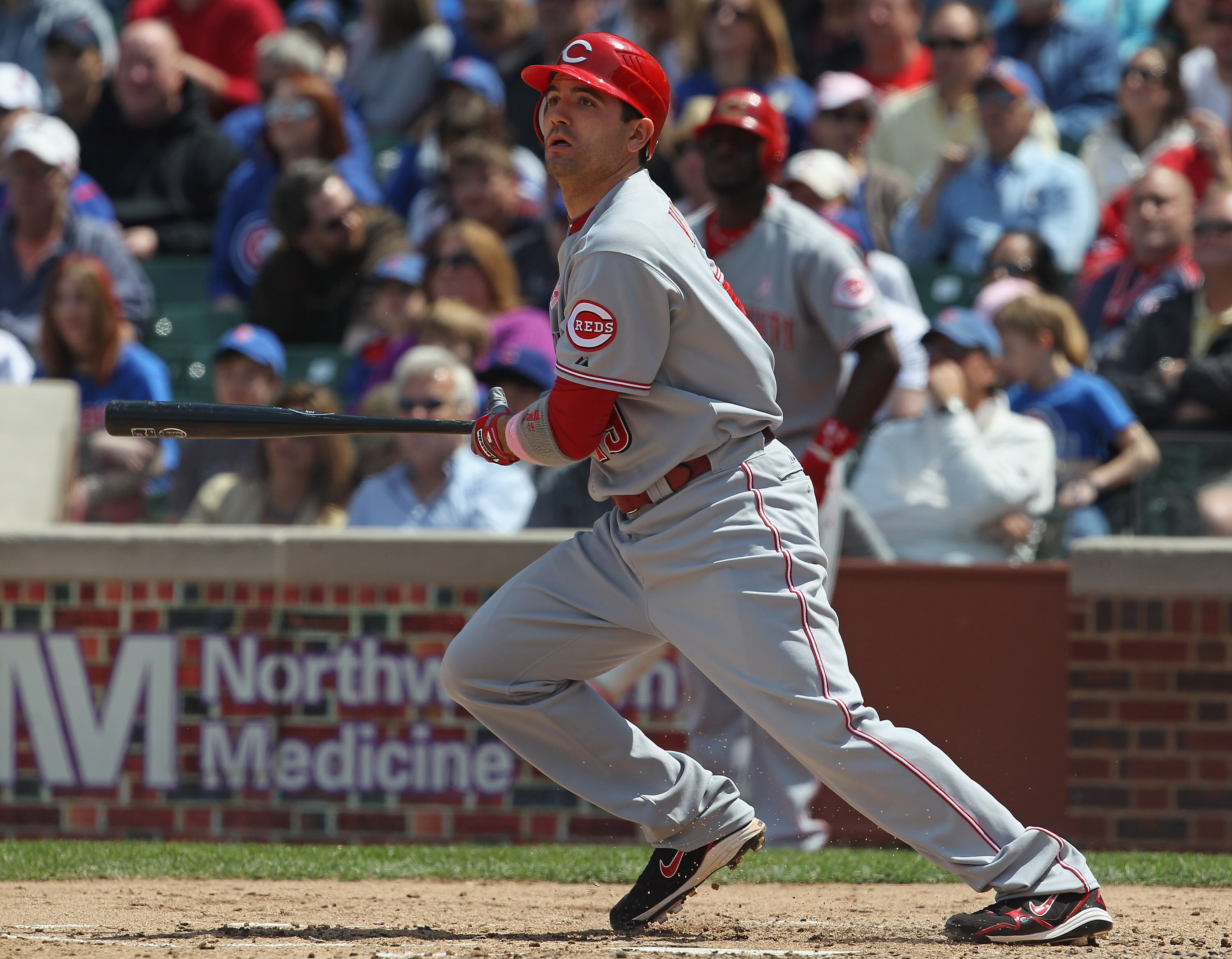 CHICAGO, IL - MAY 08: Joey Votto #19 of the Cincinnati Reds follows the flight of the ball against the Chicago Cubs at Wrigley Field on May 8, 2011 in Chicago, Illinois. The Reds defeated the Cubs 2-0.  (Photo by Jonathan Daniel/Getty Images)