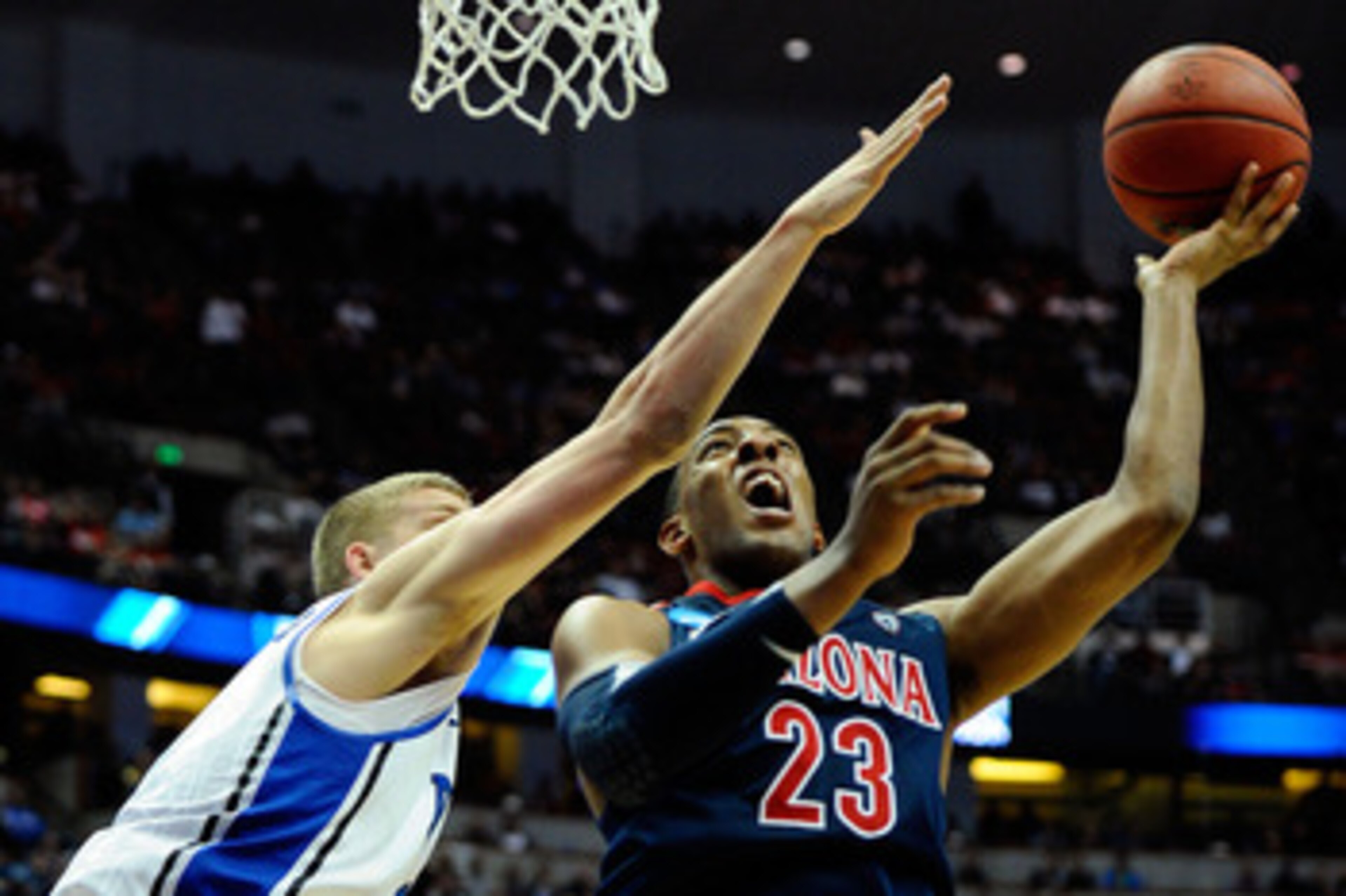 ANAHEIM, CA - MARCH 24:  Derrick Williams #23 of the Arizona Wildcats drives to the basket against Mason Plumlee #5 of the Duke Blue Devils during the west regional semifinal of the 2011 NCAA men's basketball tournament at the Honda Center on March 24, 20