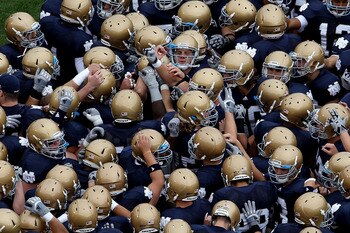 SOUTH BEND, IN - SEPTEMBER 25: Members of the Notre Dame Fighting Irish get ready during warm-ups to play the Stanford Cardinal at Notre Dame Stadium on September 25, 2010 in South Bend, Indiana. Stanford defeated Notre Dame 37-14. (Photo by Jonathan Dani