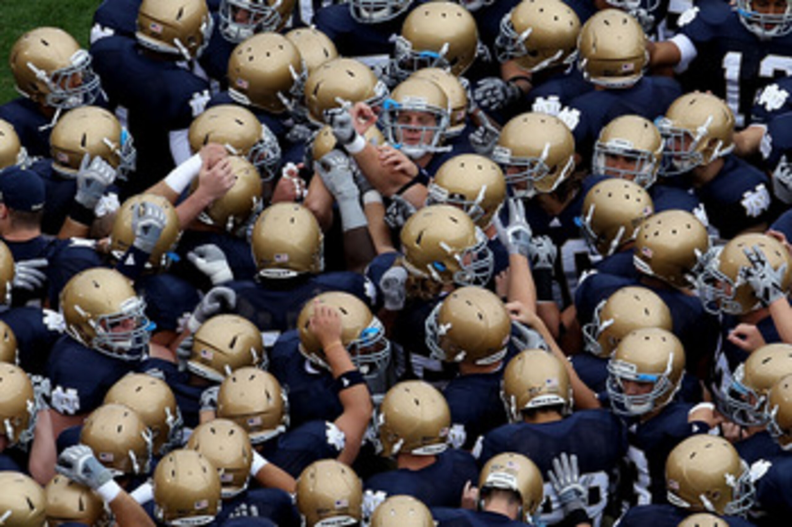SOUTH BEND, IN - SEPTEMBER 25: Members of the Notre Dame Fighting Irish get ready during warm-ups to play the Stanford Cardinal at Notre Dame Stadium on September 25, 2010 in South Bend, Indiana. Stanford defeated Notre Dame 37-14. (Photo by Jonathan Dani