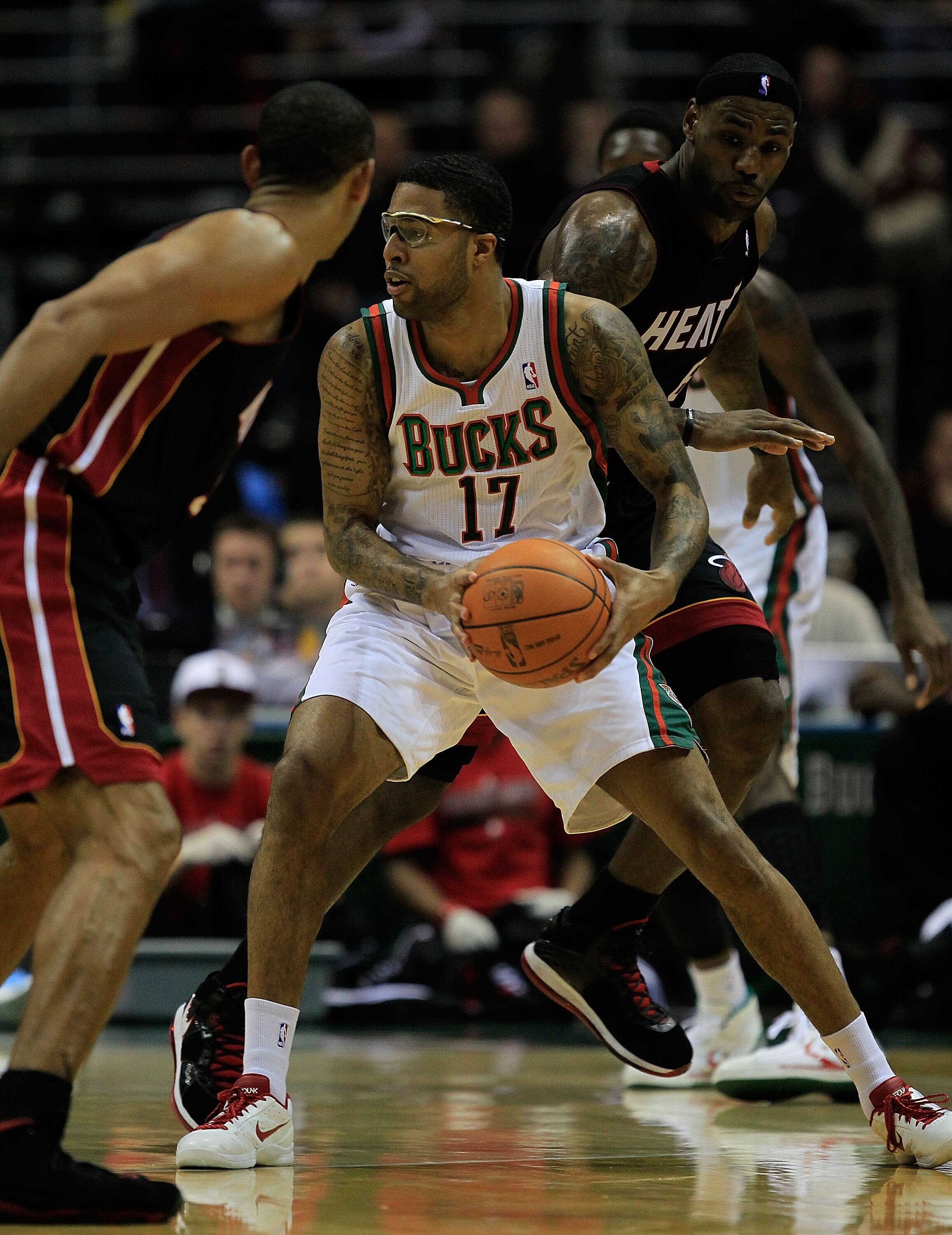 MILWAUKEE, WI - DECEMBER 06: Chris Douglas-Roberts #17 of the Milwaukee Bucks looks to pass between Juwan Howard #5 and LeBron James #6 of the Miami Heat at the Bradley Center on December 6, 2010 in Milwaukee, Wisconsin. The Heat defeated the Bucks 88-78.