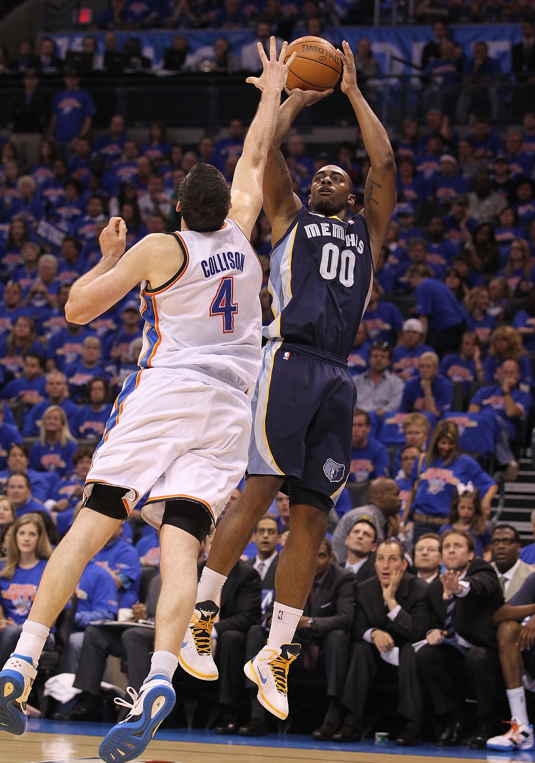 OKLAHOMA CITY, OK - MAY 15: Forward Darrell Arthur #00 of the Memphis Grizzlies takes a shot against Nick Collison #4 of the Oklahoma City Thunder in Game Seven of the Western Conference Semifinals in the 2011 NBA Playoffs on May 15, 2011 at Oklahoma City