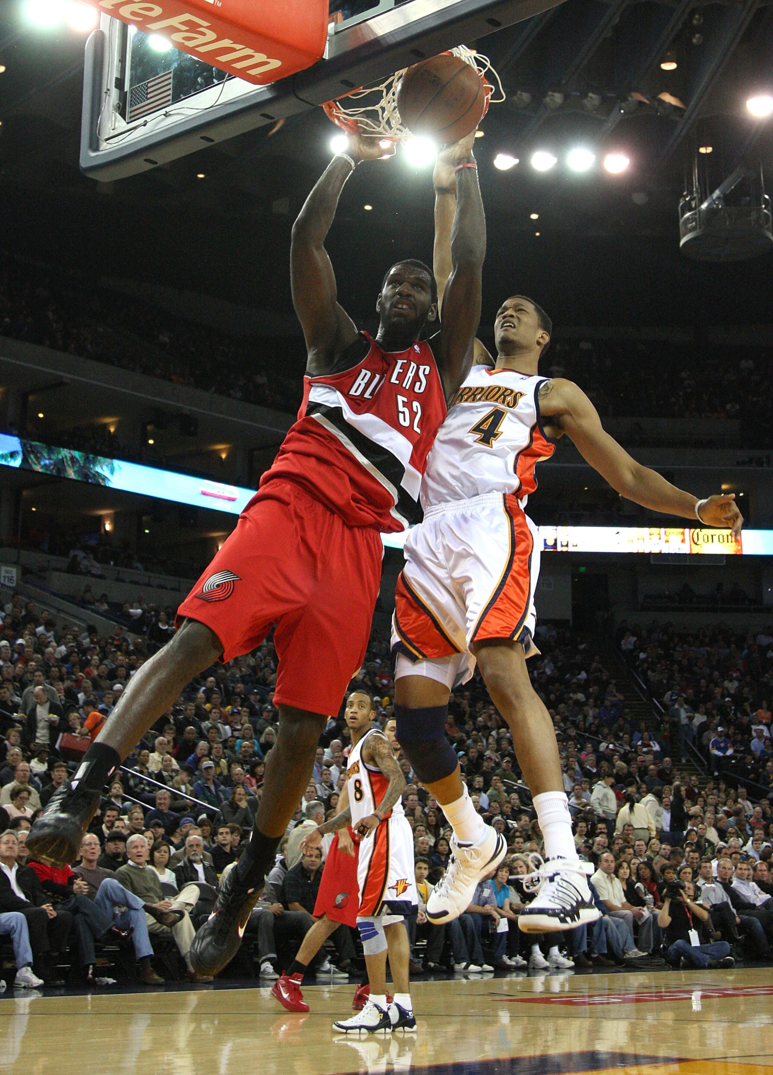 OAKLAND, CA - NOVEMBER 20:  Greg Oden #52 of the Portland Trail Blazers dunks over Anthony Randolph #4 of the Golden State Warriors during an NBA game at Oracle Arena on November 20, 2009 in Oakland, California. (Photo by Jed Jacobsohn/Getty Images)