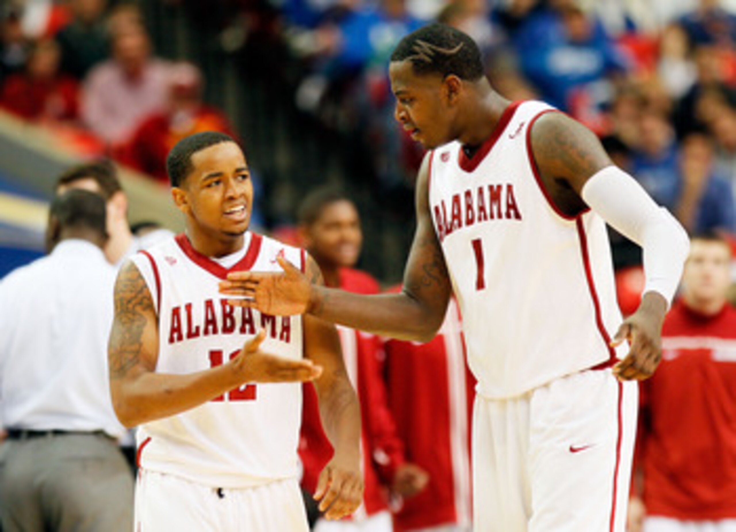 ATLANTA, GA - MARCH 11:  JaMychal Green #1 and Trevor Releford #12 of the Alabama Crimson Tide celebrate after drawing a foul during the quarterfinals of the SEC Men's Basketball Tournament at Georgia Dome on March 11, 2011 in Atlanta, Georgia.  (Photo by