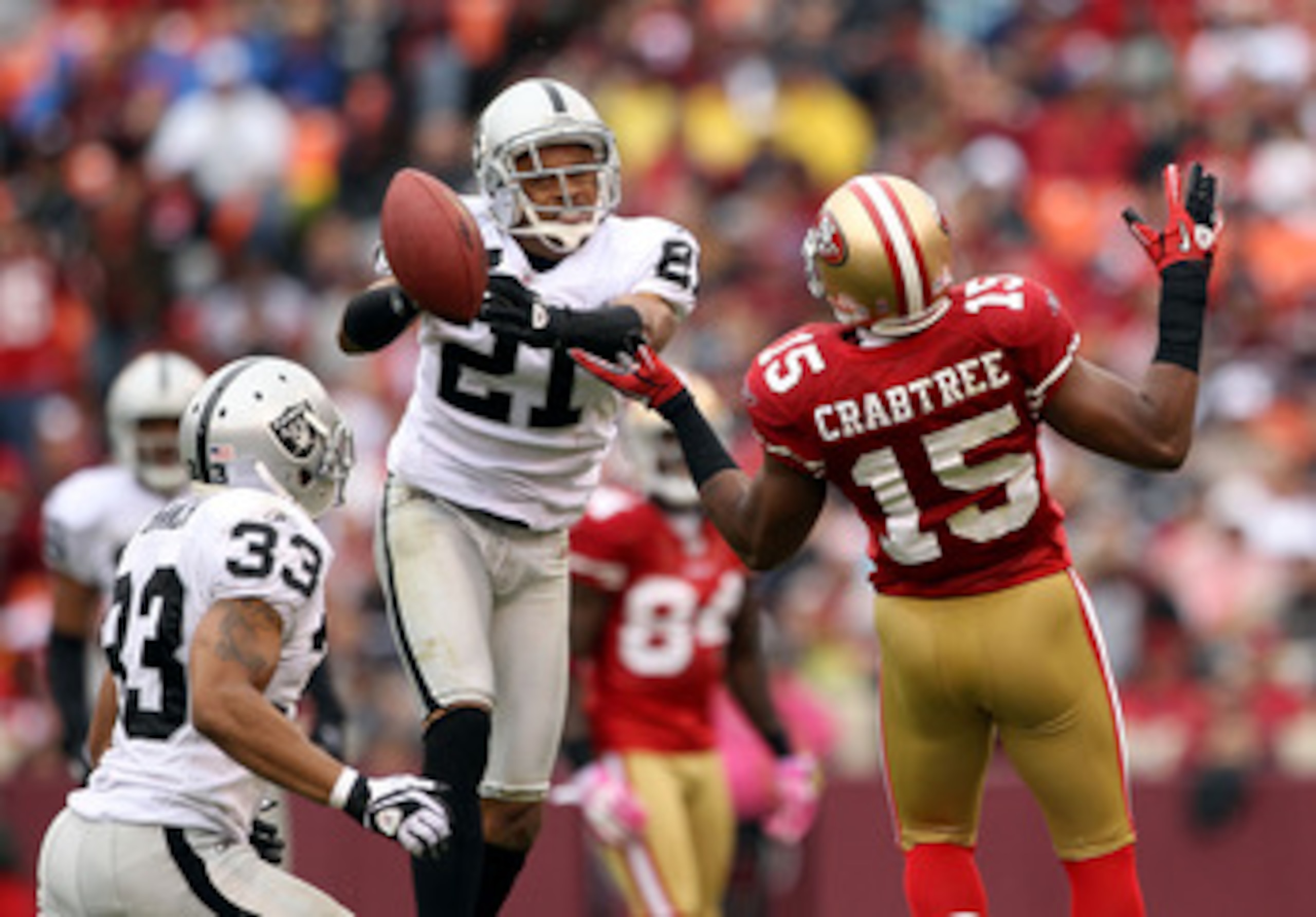 SAN FRANCISCO - OCTOBER 17:  Nnamdi Asomugha  #21 of the Oakland Raiders breaks up a pass intended for Michael Crabtree #15 of the San Francisco 49ers at Candlestick Park on October 17, 2010 in San Francisco, California.  (Photo by Ezra Shaw/Getty Images)
