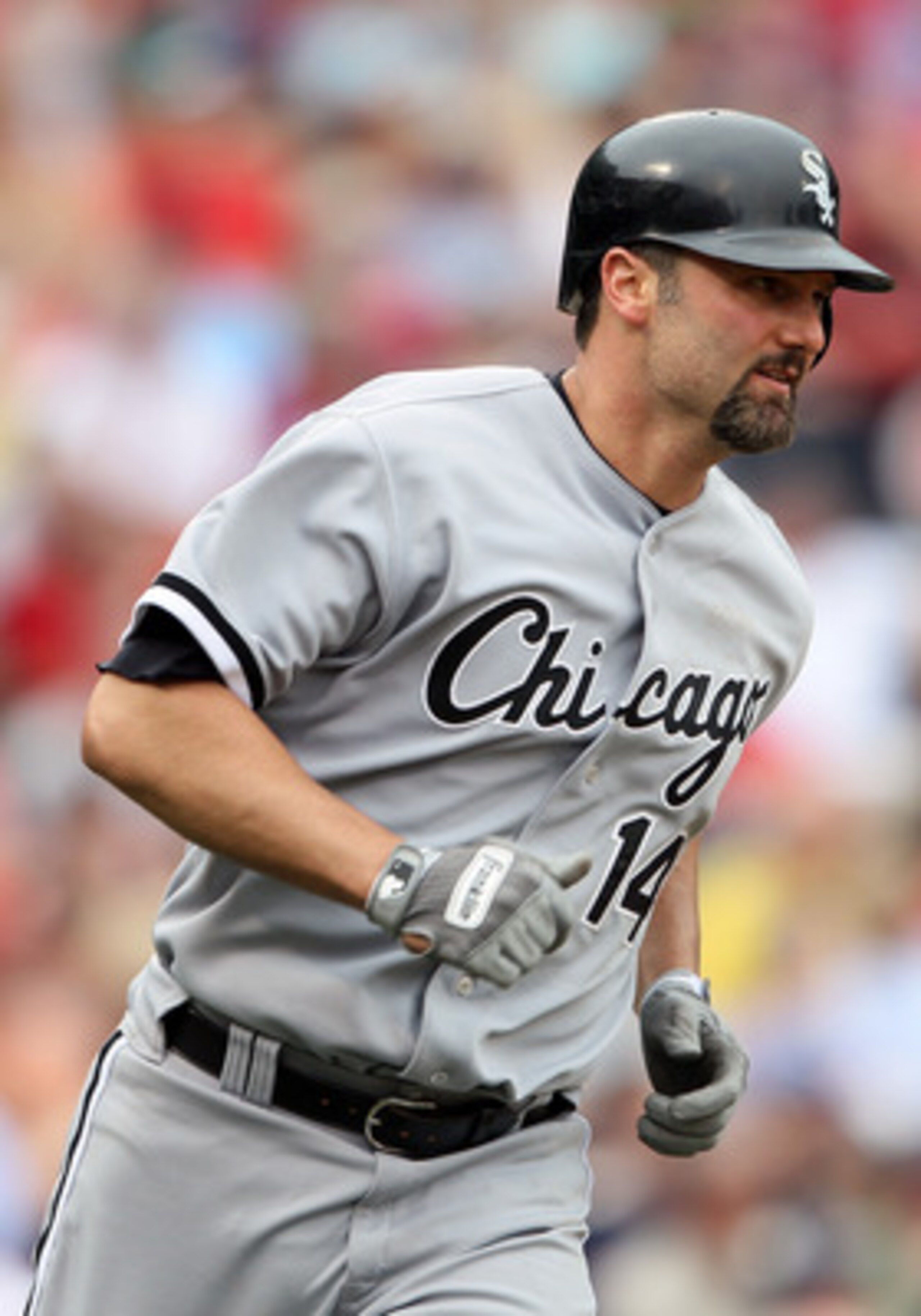 BOSTON, MA - JUNE 01:  Paul Konerko #14 of the Chicago White Sox rounds first after he hit a two run home run in the ninth inning against the Boston Red Sox on June 1, 2011 at Fenway Park in Boston, Massachusetts.  (Photo by Elsa/Getty Images)