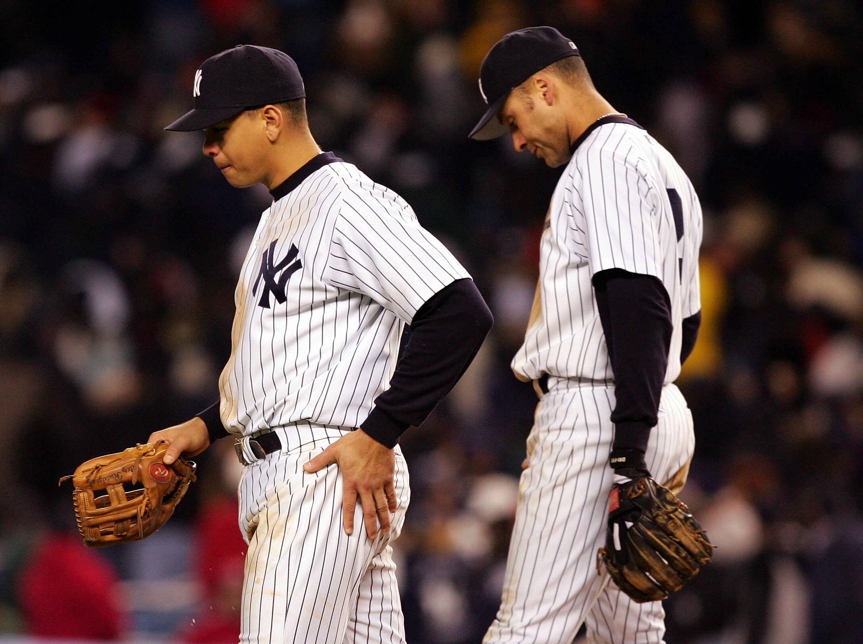 NEW YORK - OCTOBER 20:  Alex Rodriguez #13 and Derek Jeter #2 of the New York Yankees walk back to the dugout after the end of the eighth inning against the Boston Red Sox during game seven of the American League Championship Series on October 20, 2004 at