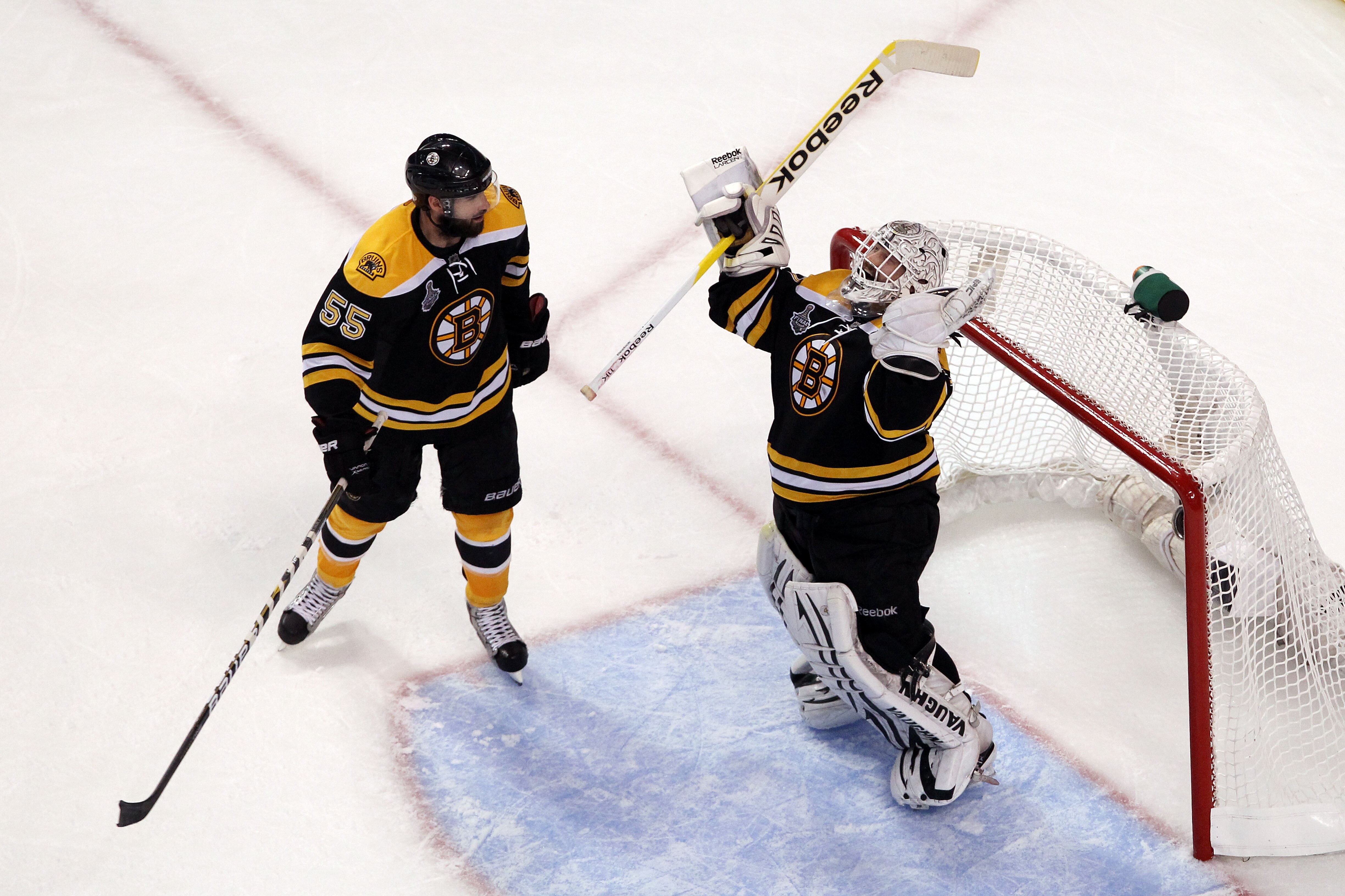 BOSTON, MA - JUNE 08:  Tim Thomas #30 of the Boston Bruins celebrates with his teammate Johnny Boychuk #55 after defeating the Vancouver Canucks in Game Four of the 2011 NHL Stanley Cup Final at TD Garden on June 8, 2011 in Boston, Massachusetts. The Bost