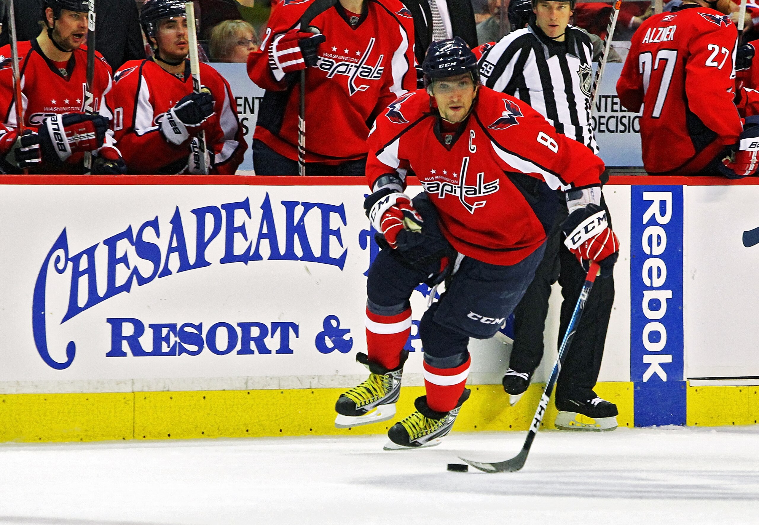 WASHINGTON , DC - APRIL 23:  Alex Ovechkin #8 of the Washington Capitals skates the puck across the blue line against the New York Rangers in Game Five of the Eastern Conference Quarterfinals during the 2011 NHL Stanley Cup Playoffs at the Verizon Center