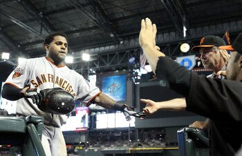 PHOENIX, AZ - APRIL 17:  Pablo Sandoval #48 of the San Francisco Giants high fives manager Bruce Bochy after Sandoval hit a solo home run against the Arizona Diamondbacks during the sixth inning of the Major League Baseball game at Chase Field on April 17