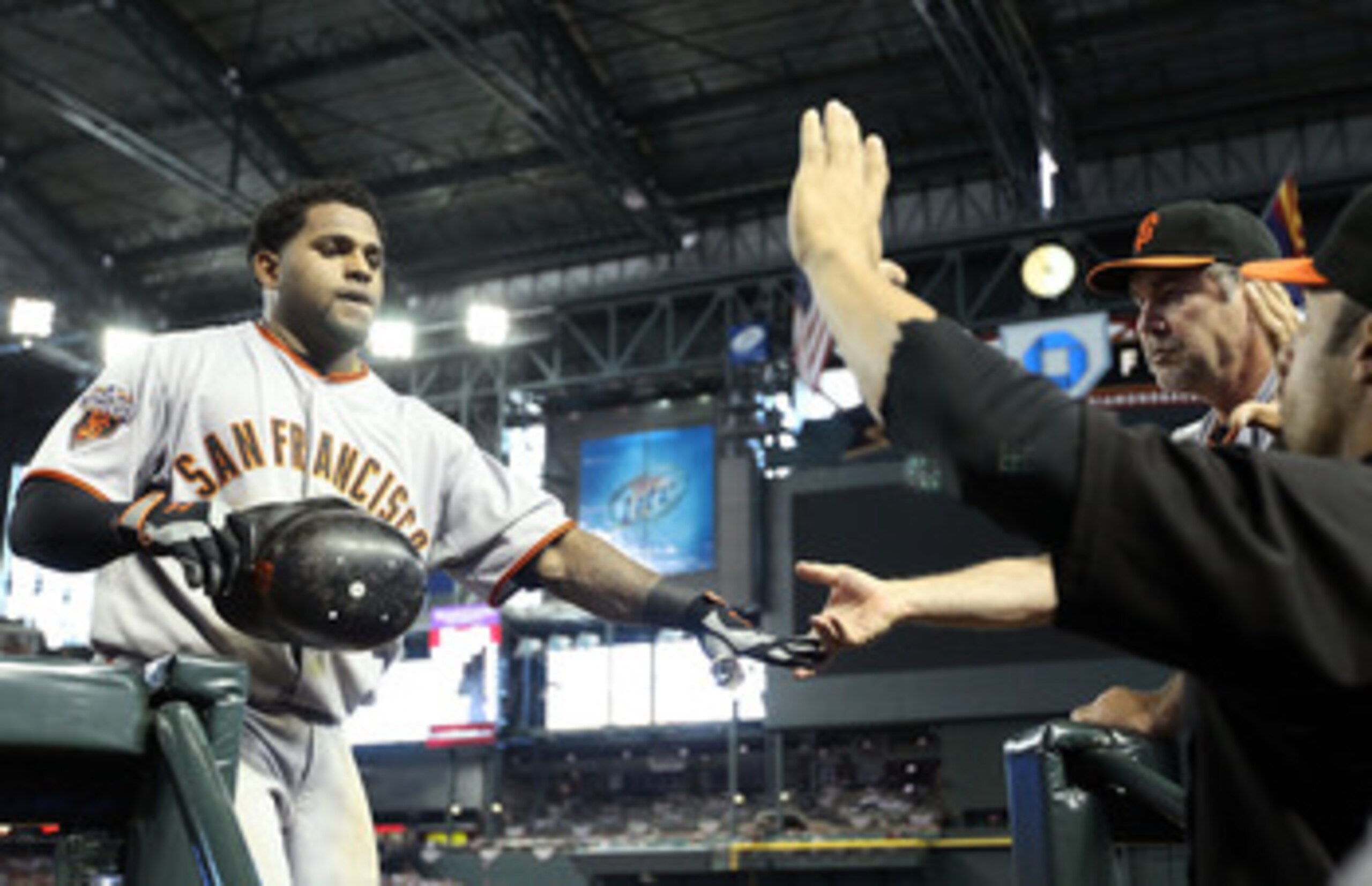 PHOENIX, AZ - APRIL 17:  Pablo Sandoval #48 of the San Francisco Giants high fives manager Bruce Bochy after Sandoval hit a solo home run against the Arizona Diamondbacks during the sixth inning of the Major League Baseball game at Chase Field on April 17