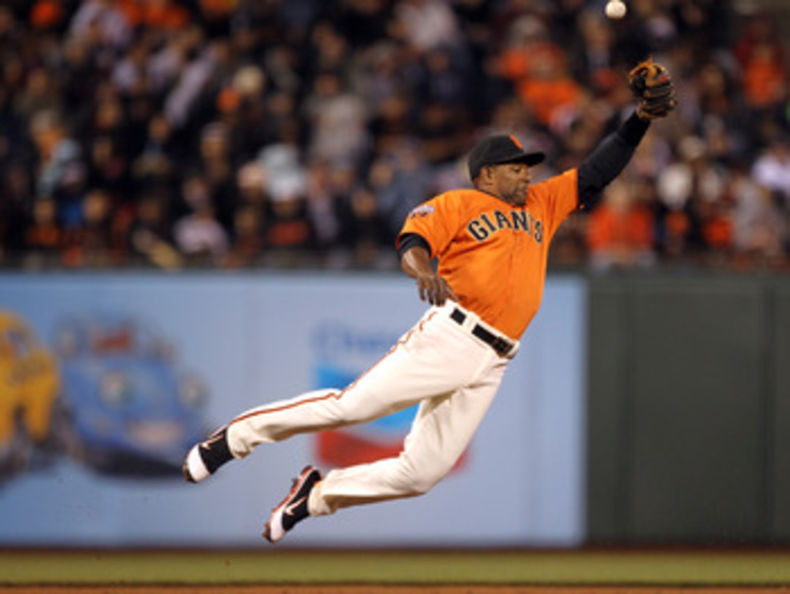 SAN FRANCISCO, CA - MAY 06:  Miguel Tejada #10 of the San Francisco Giants can't catch a ball hit by Todd Helton #17 of the Colorado Rockies at AT&T Park on May 6, 2011 in San Francisco, California.  (Photo by Ezra Shaw/Getty Images)