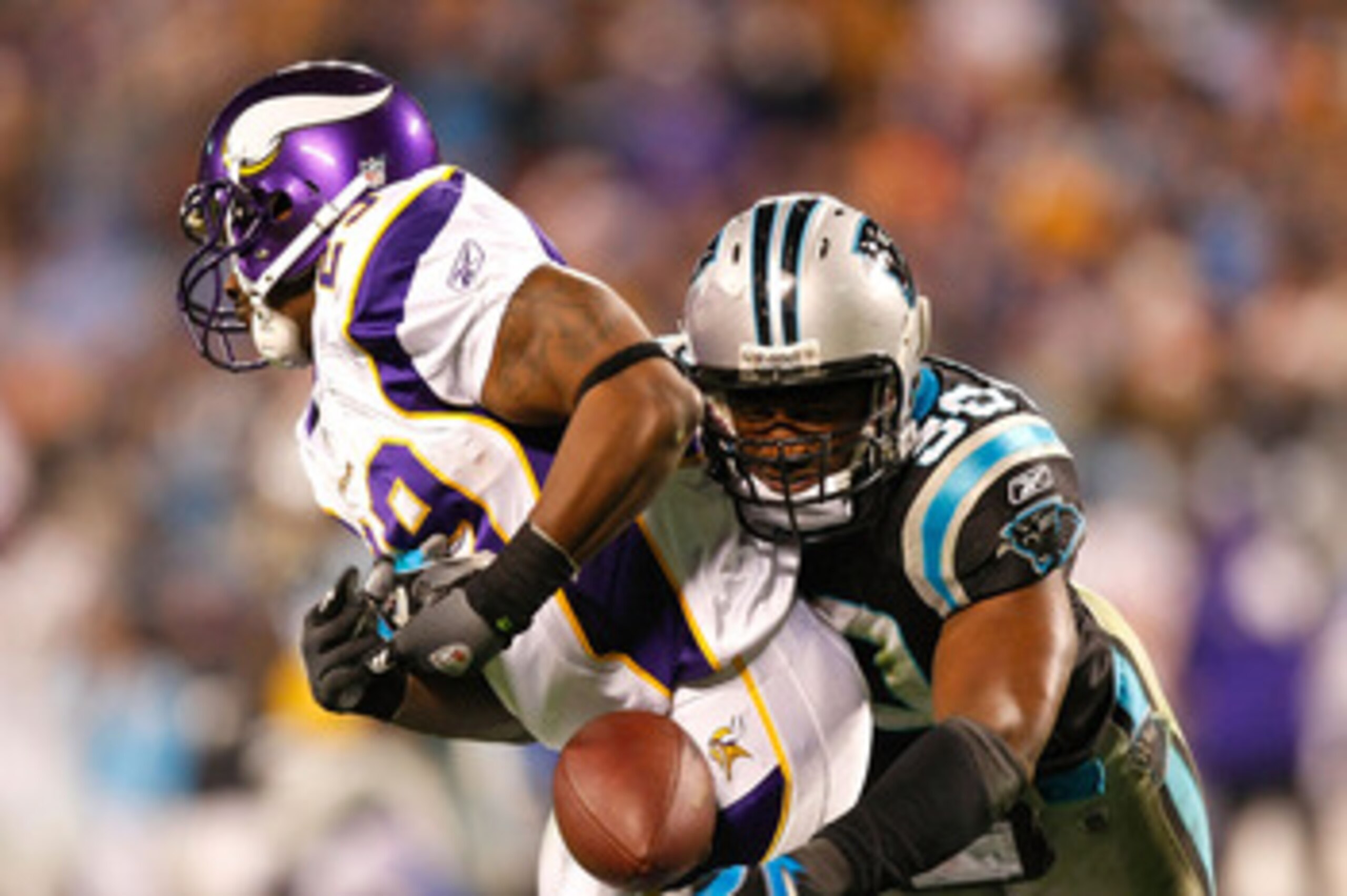 CHARLOTTE, NC - DECEMBER 20:  James Anderson #50 of the Carolina Panthers breaks up a reception by Chester Taylor #29 of the Minnesota Vikings at Bank of America Stadium on December 20, 2009 in Charlotte, North Carolina.  (Photo by Kevin C. Cox/Getty Imag