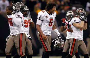 NEW ORLEANS, LA - JANUARY 02:  Josh Freeman #5 of the Tampa Bay Buccaneers reacts to being sacked during the game against the New Orleans Saints at the Louisiana Superdome on January 2, 2011 in New Orleans, Louisiana.  (Photo by Chris Graythen/Getty Image
