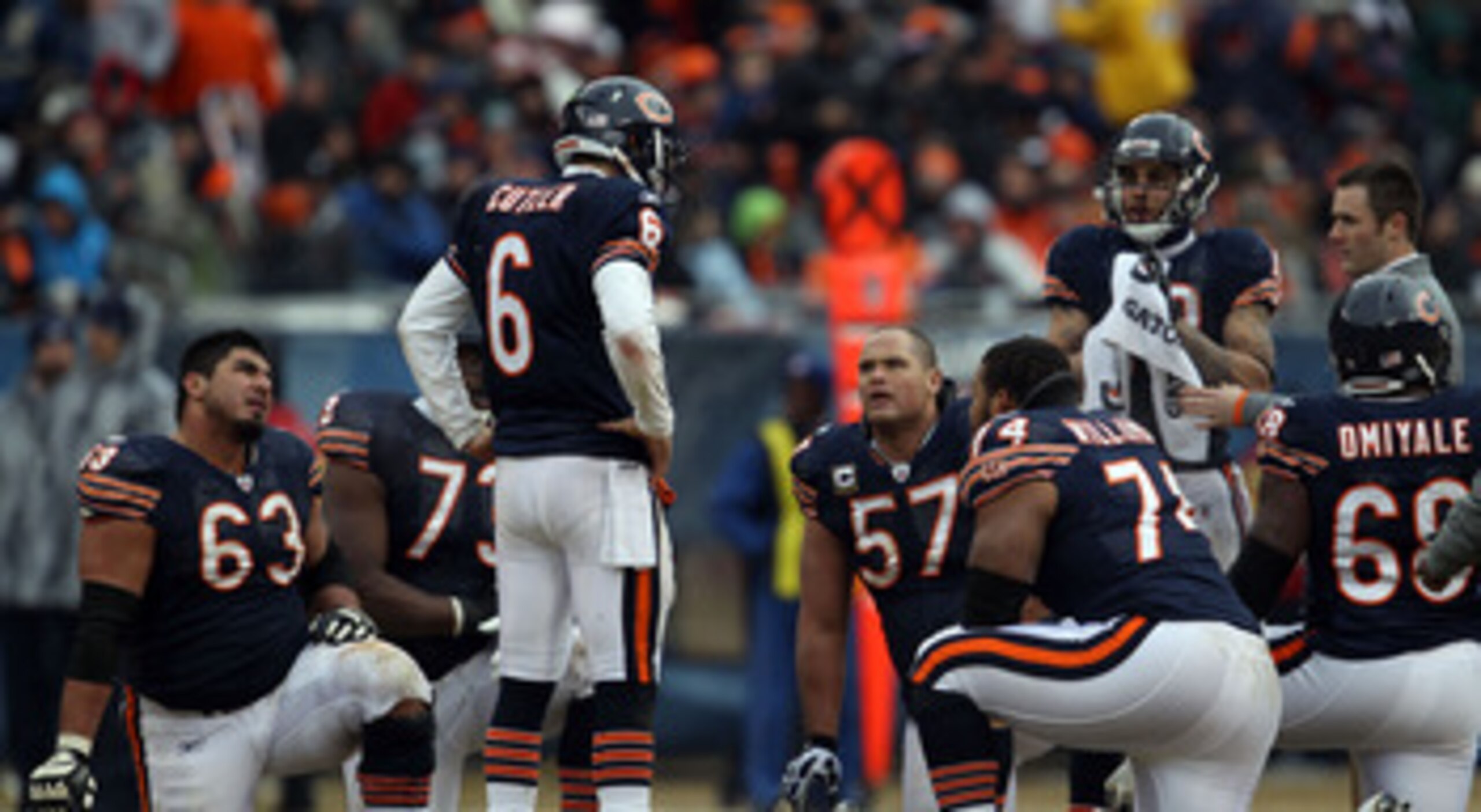 CHICAGO, IL - JANUARY 16:  Quarterback Jay Cutler #6 of the Chicago Bears talks with his offense as Marcus Trufant #23 of the Seattle Seahawks is injured on the field in the second half against the Seattle Seahawks in the 2011 NFC divisional playoff game 