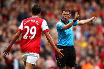 LONDON, ENGLAND - MAY 15:  Marouane Chamakh of Arsenal argues with referee Michael Oliver during the Barclays Premier League match between Arsenal and Aston Villa at the Emirates Stadium on May 15, 2011 in London, England.  (Photo by Richard Heathcote/Get