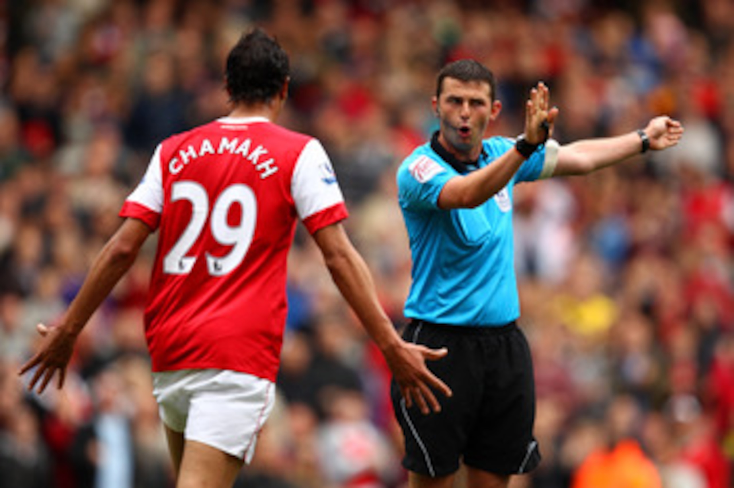 LONDON, ENGLAND - MAY 15:  Marouane Chamakh of Arsenal argues with referee Michael Oliver during the Barclays Premier League match between Arsenal and Aston Villa at the Emirates Stadium on May 15, 2011 in London, England.  (Photo by Richard Heathcote/Get